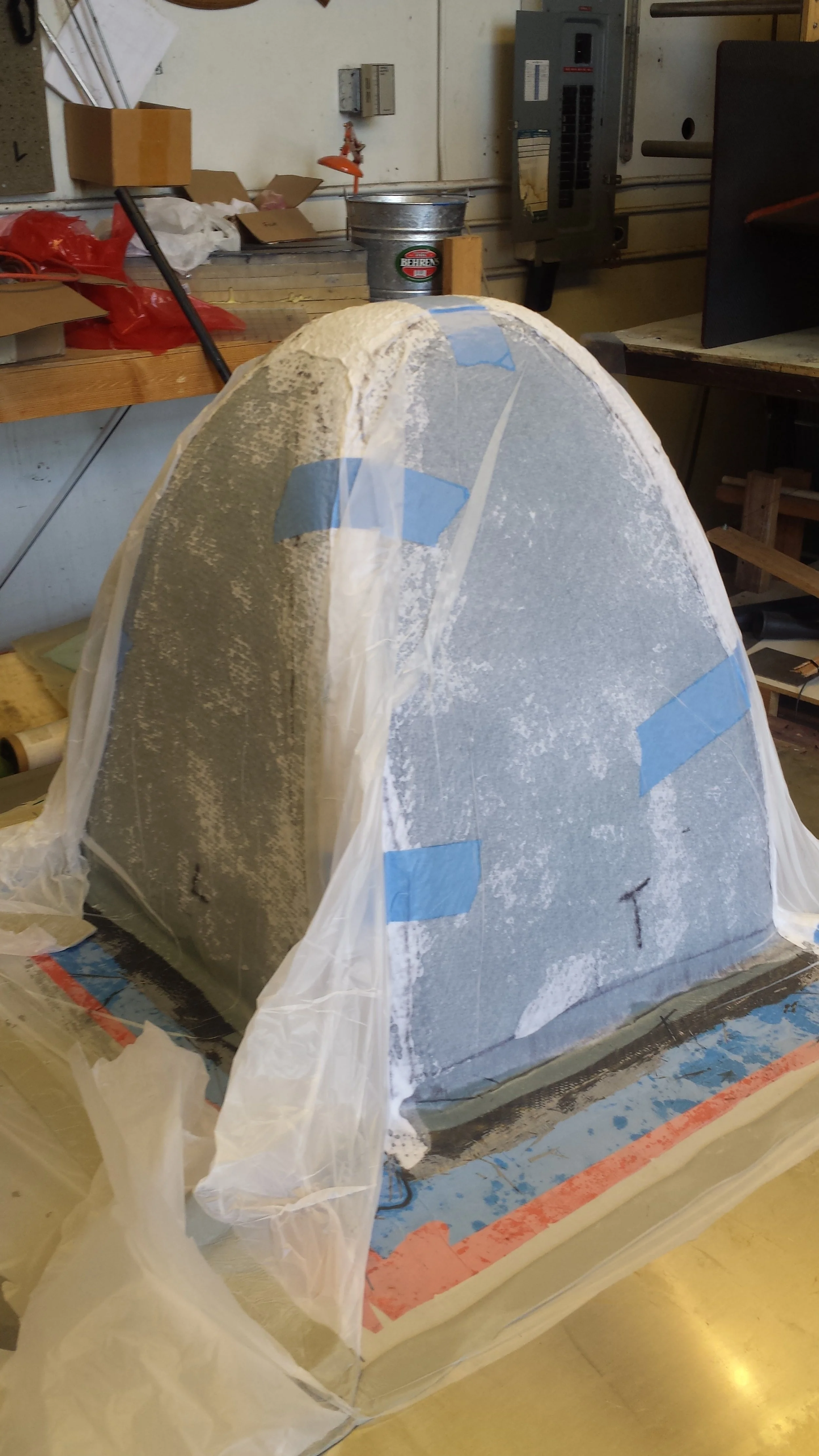 Vacuum bagging and curing carbon fiber resin on the nose cone