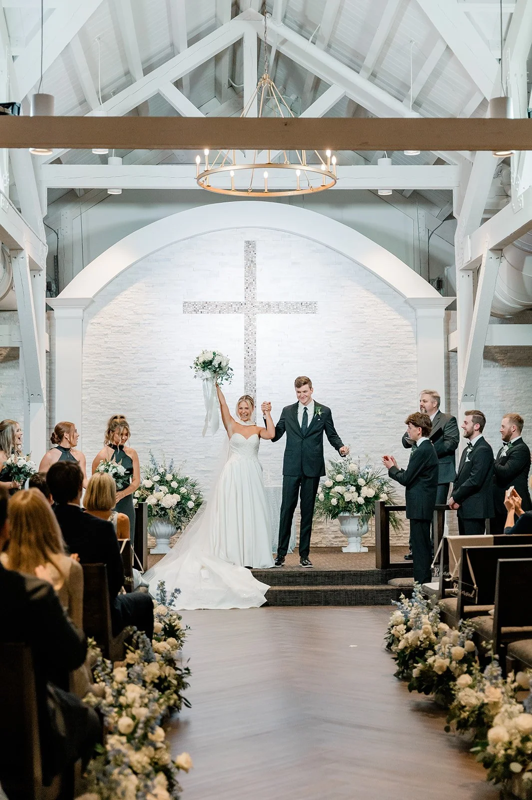 Bride and groom exchanging vows in the sanctuary at Celebration Grove, a sacred indoor wedding venue in Vero Beach with soaring ceilings and natural light.