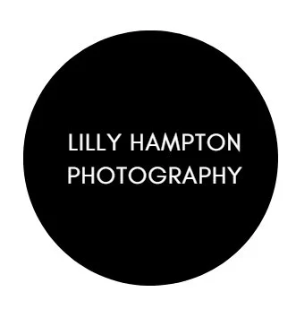 Black circle with white text saying 'Lilly Hampton Photography' - a recommended wedding photography and film vendor at Celebration Grove Wedding and Event Venue in Vero Beach, FL.