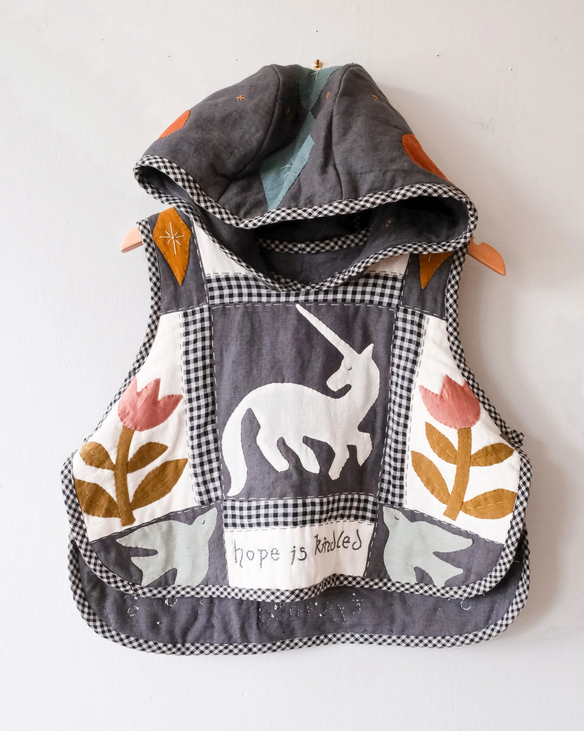 ⚔️ SOFT ARMOR ⚔️ 

Inspired by chainmail hoods, helmets, and heraldry-adorned tabards worn by knights of ye olde times, but made of soft, squishy, warm quilted fabric. A wearable reminder to not harden your heart, even though the world is hard.

A fa