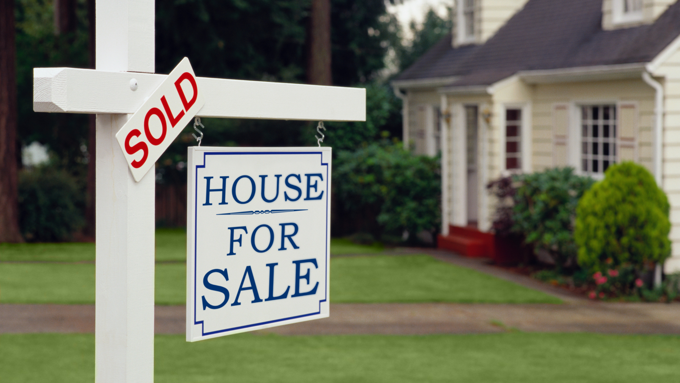 For sale sign representing listing and closing a home