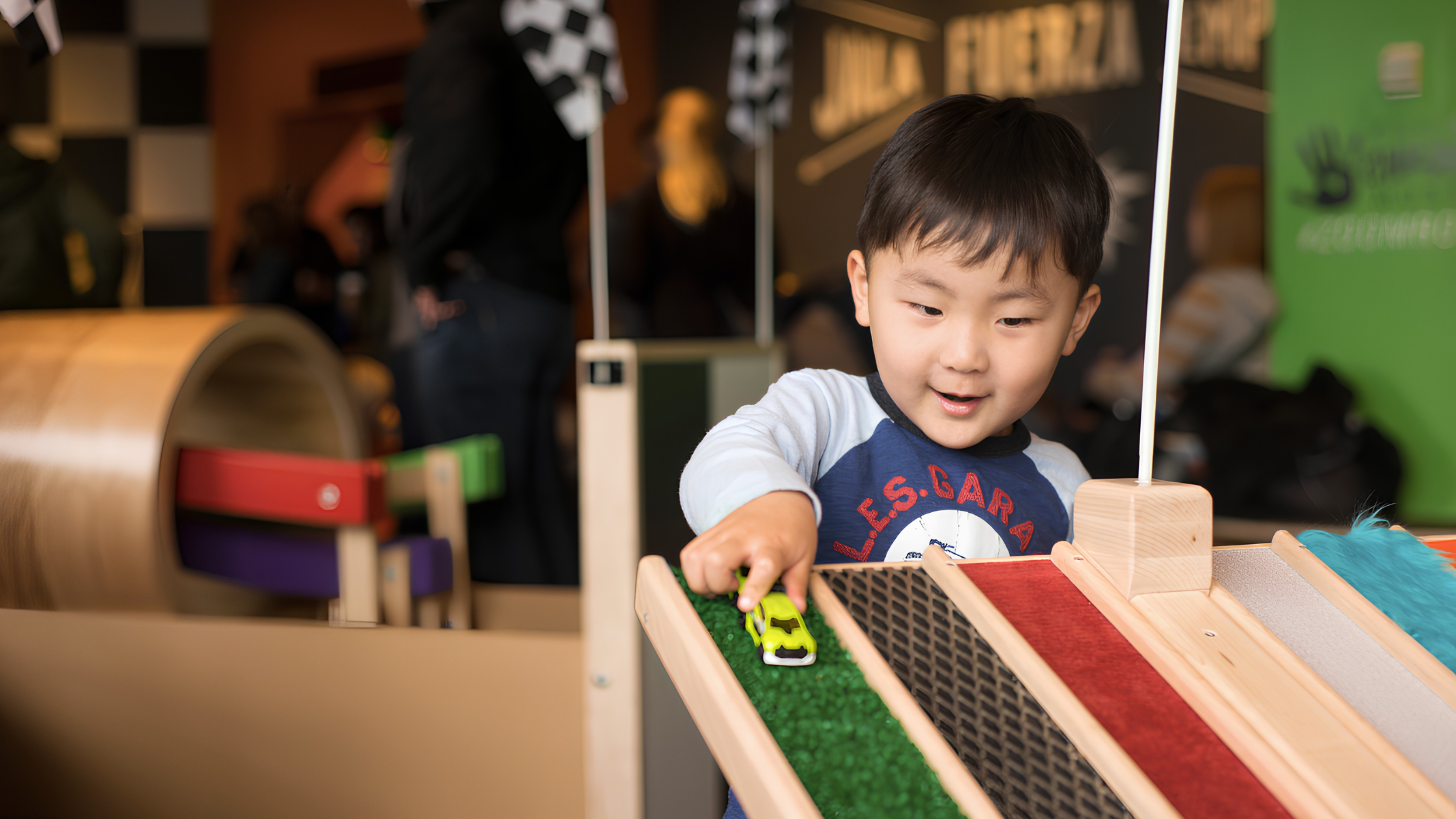 A young visitor plays at the recently returned "Zoom Room" exhibit at the Chicago Children's Museum on Navy Pier. Credit: Chicago Children's Museum