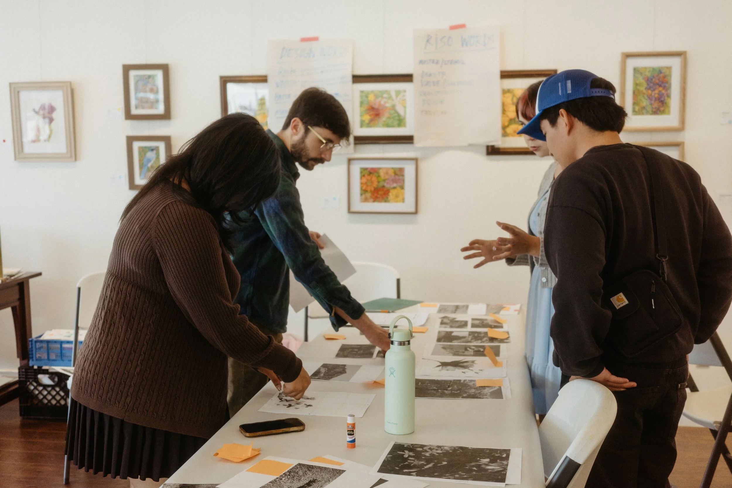Photographers assemble a handmade photography book.
