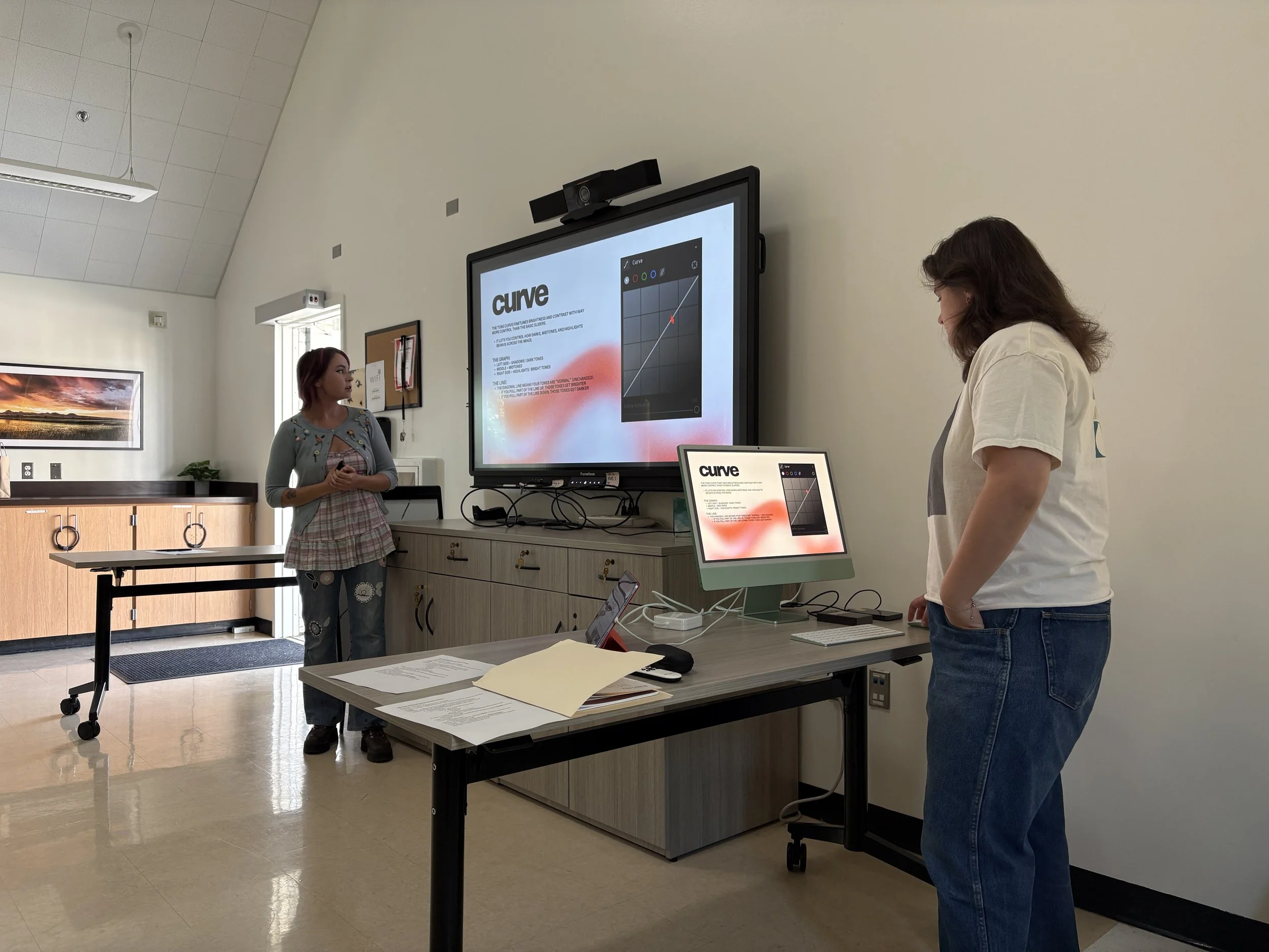 Two teaching artists lead a workshop on digital image editing in Williams, California.