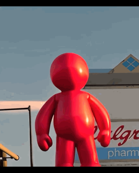 Pink balloon figure floating through city streets in the AI short film Float