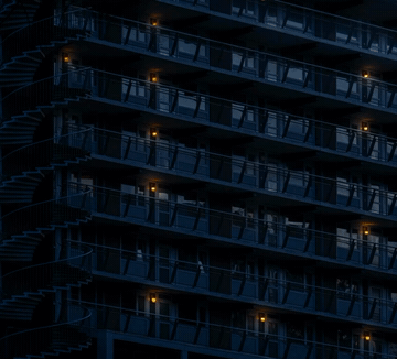 Without the Lights On. Amsterdam apartment block at night, 2026