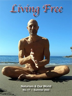 Cover of "Living Free" magazine showing a person sitting cross-legged on a beach with the ocean in the background. The text reads: "Living Free, Naturism & Our World, No. 17 — Summer 2023."