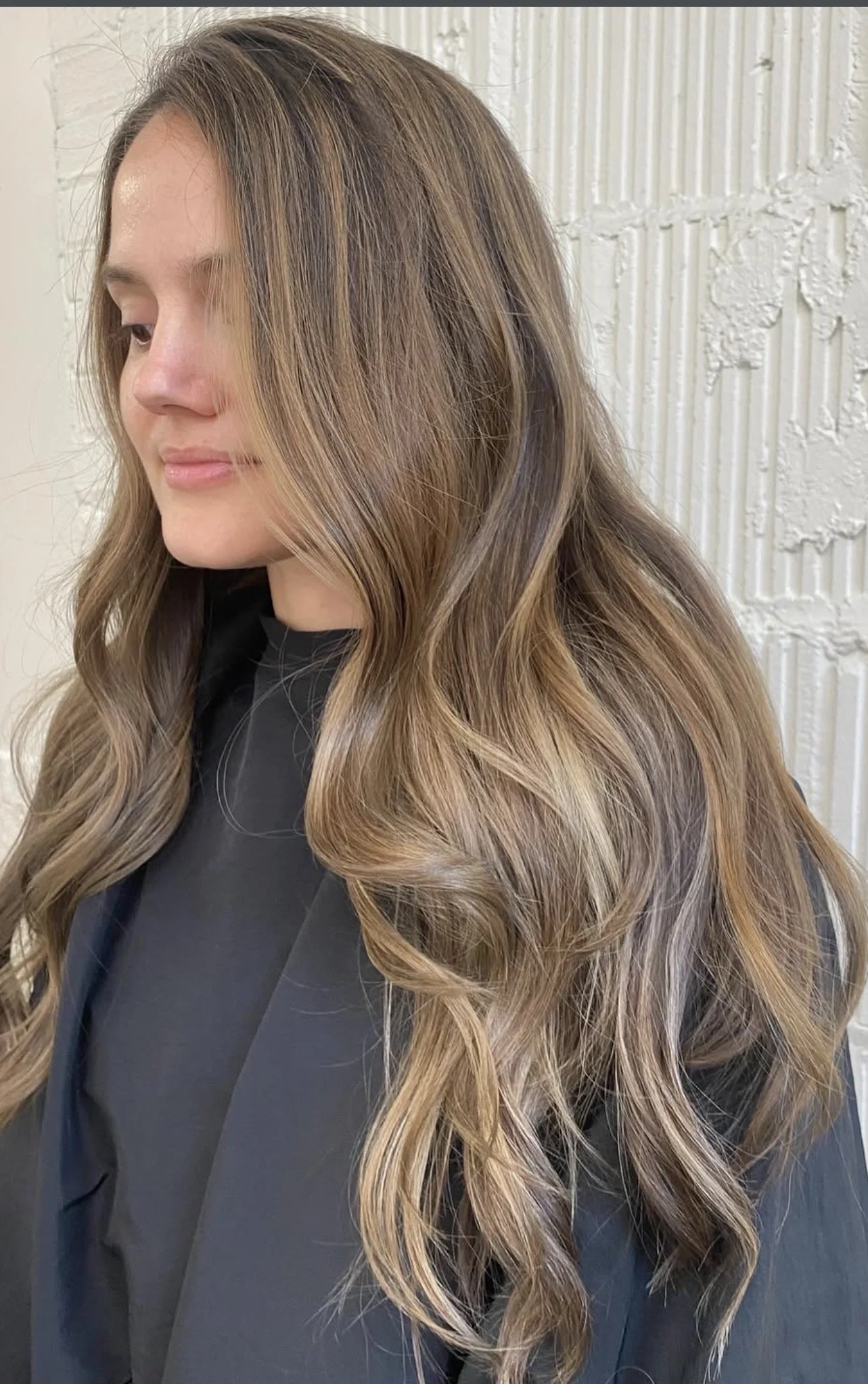 Brunette balayage with soft caramel highlights and long waves at Rustic Ritual Beauty, a low-toxic hair salon in Asheville, NC