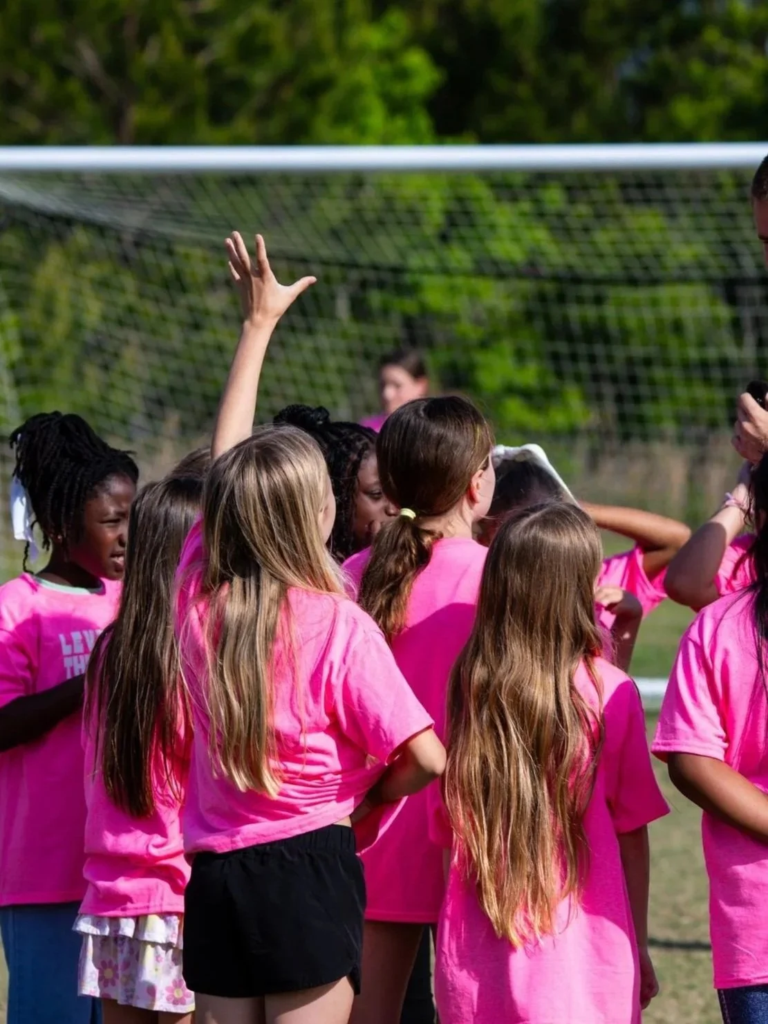 A group of girls in the empowerplay program listening and asking questions