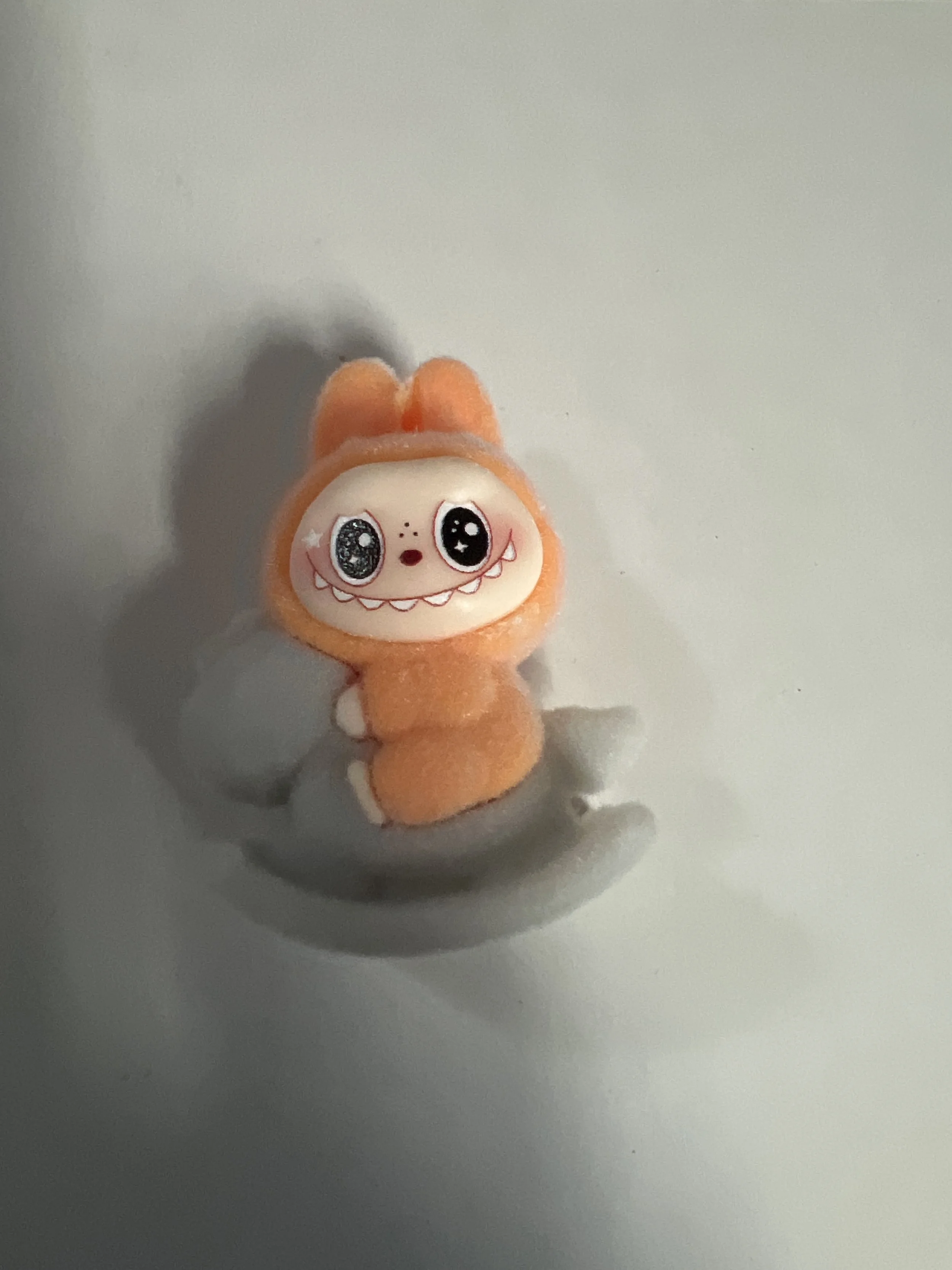 La Bubu Orange and Gray on Rocking Horse