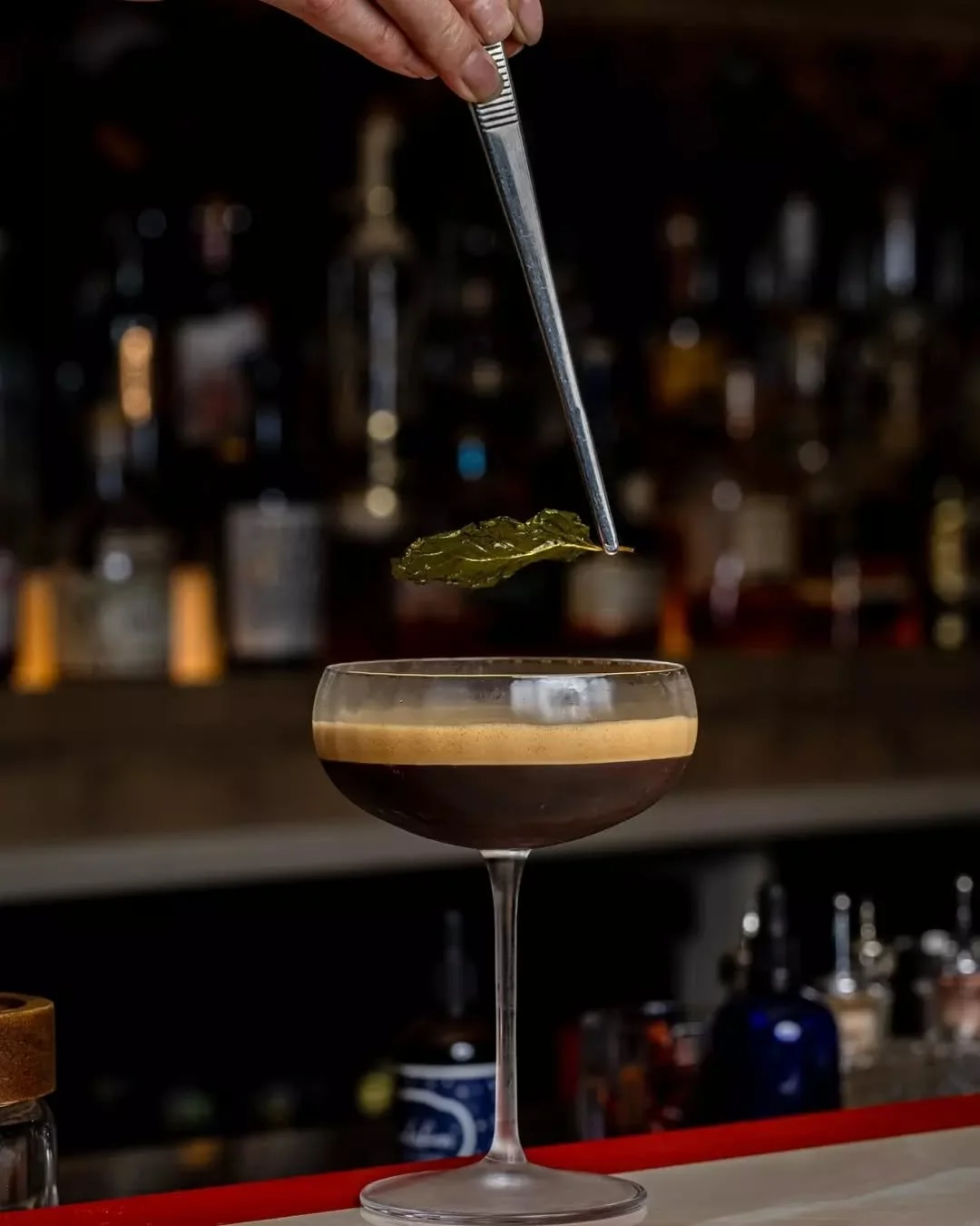 A ritual in a glass. The Conductor&rsquo;s Curse blends Jumping Goat Vodka, Fernet, Absinthe, brown sugar, and coffee. Available during  our Happy Hour everyday from 5-7pm.