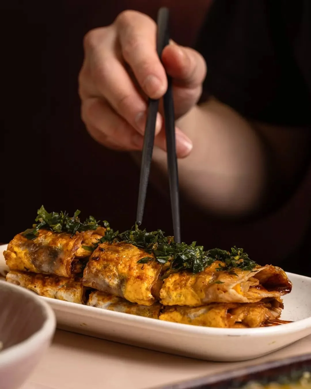 Kao Leng Mian comes from the night-stalls of Heilongjiang, where smoky grilled mian pi and bold sauces were a late-evening classic. We lift those northern flavours with charred noodles, tofu, enoki and a refined Nightcar finish.