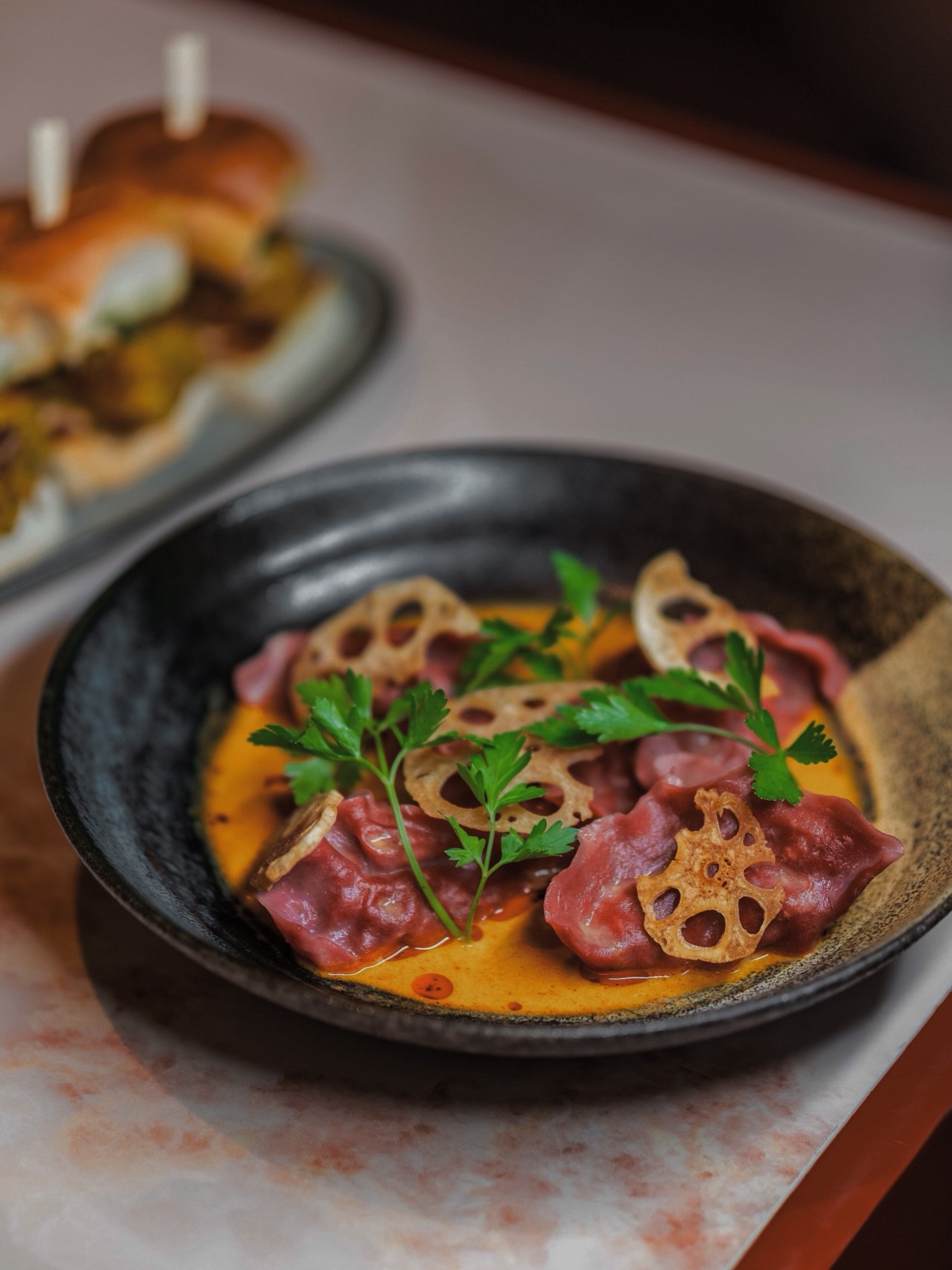 Duck Dumplings 🥟 layered with bamboo shoots, water chestnuts, parsley, lotus root and finished in a fragrant yellow curry. Texture, depth, and warmth in every bite. 

Reserved your table. Link in Bio. Walk-ins always welcome.