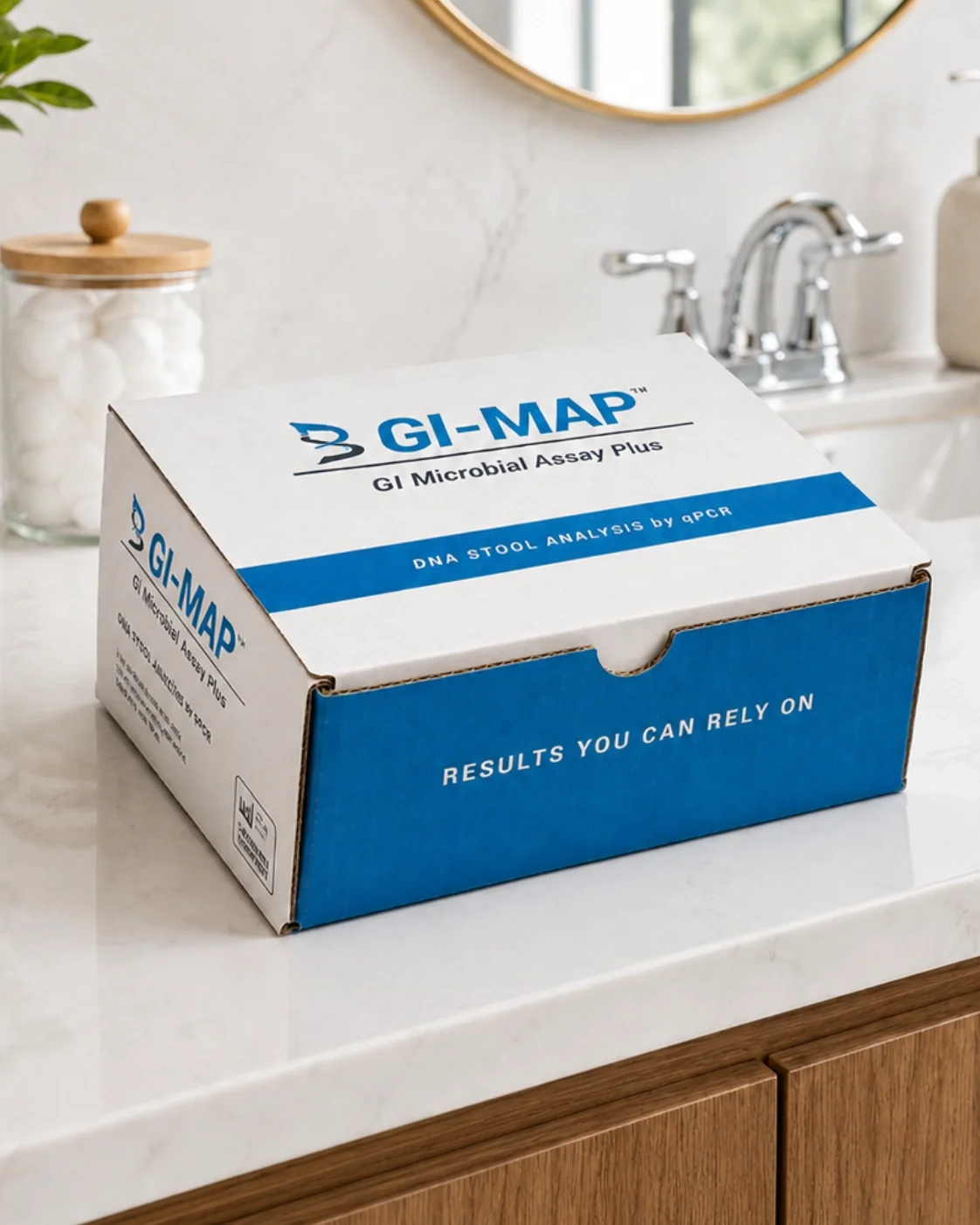 A box labeled 'GI-MAP' on a white kitchen countertop, with a sink and mirror in the background.