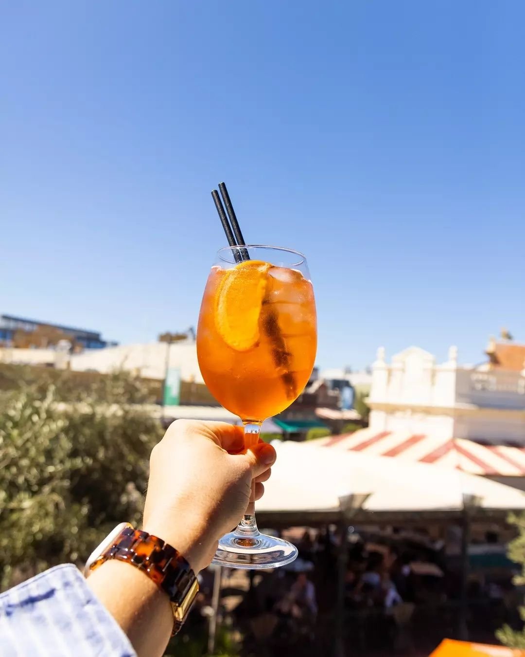 Sip on an Aperol Spritz as you watch the world go by&nbsp;🍊