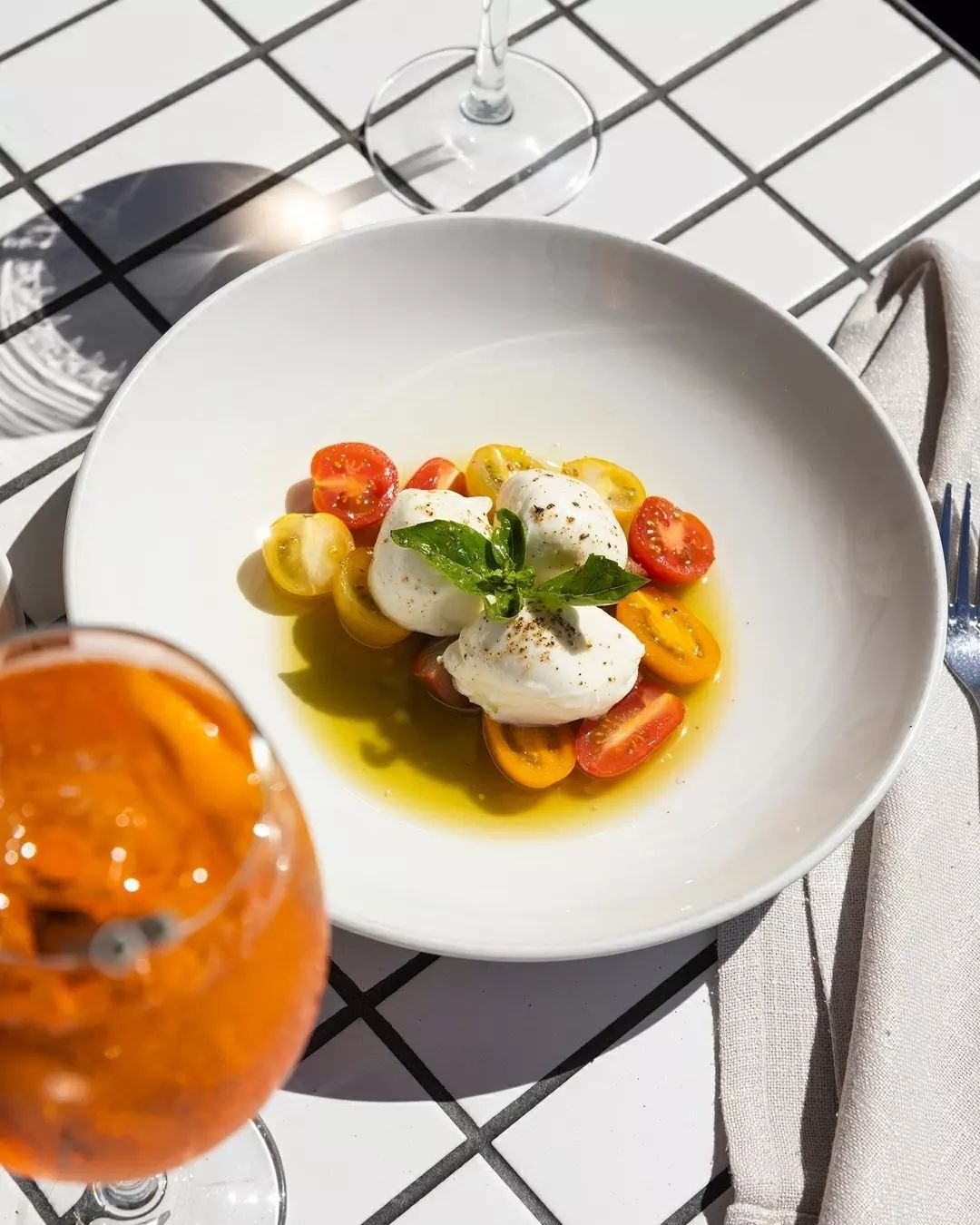All you need is a little sunshine and Caprese! 

Buffalo bocconcini mozzarella, heirloom cherry tomatoes, basil, olive oil