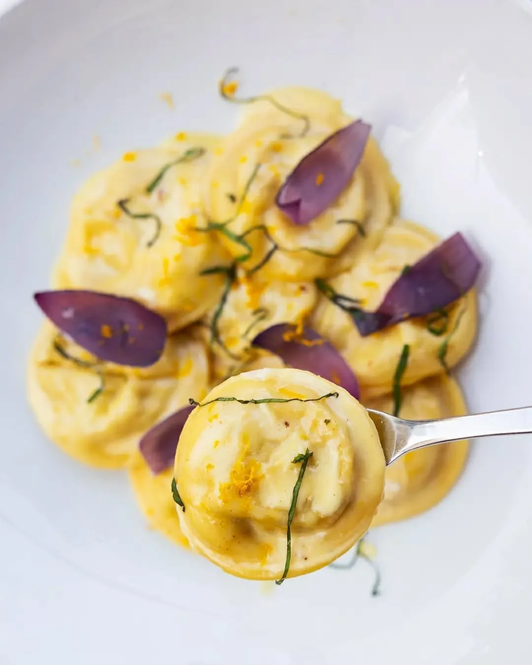 Ravioli Porcini with parmesan fondue, slow-roasted shallot, mint and orange zest 🍊