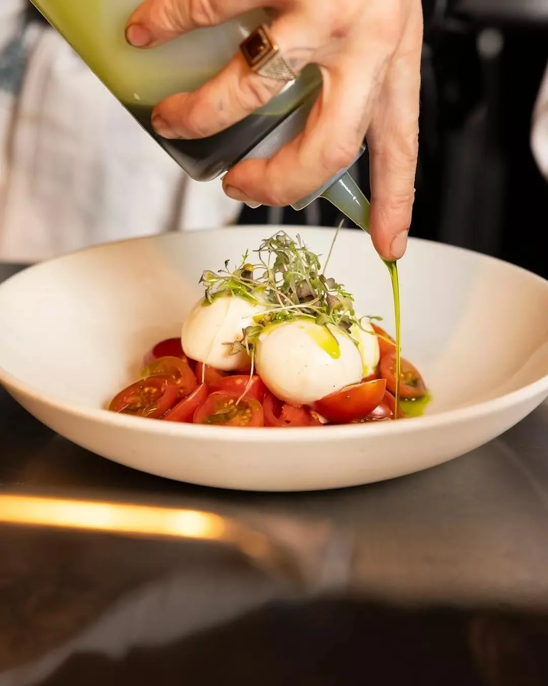 Caprese di Bufala 🍅 
A classic.
Buffalo bocconcini mozzarella, heirloom cherry tomatoes, basil, olive oil