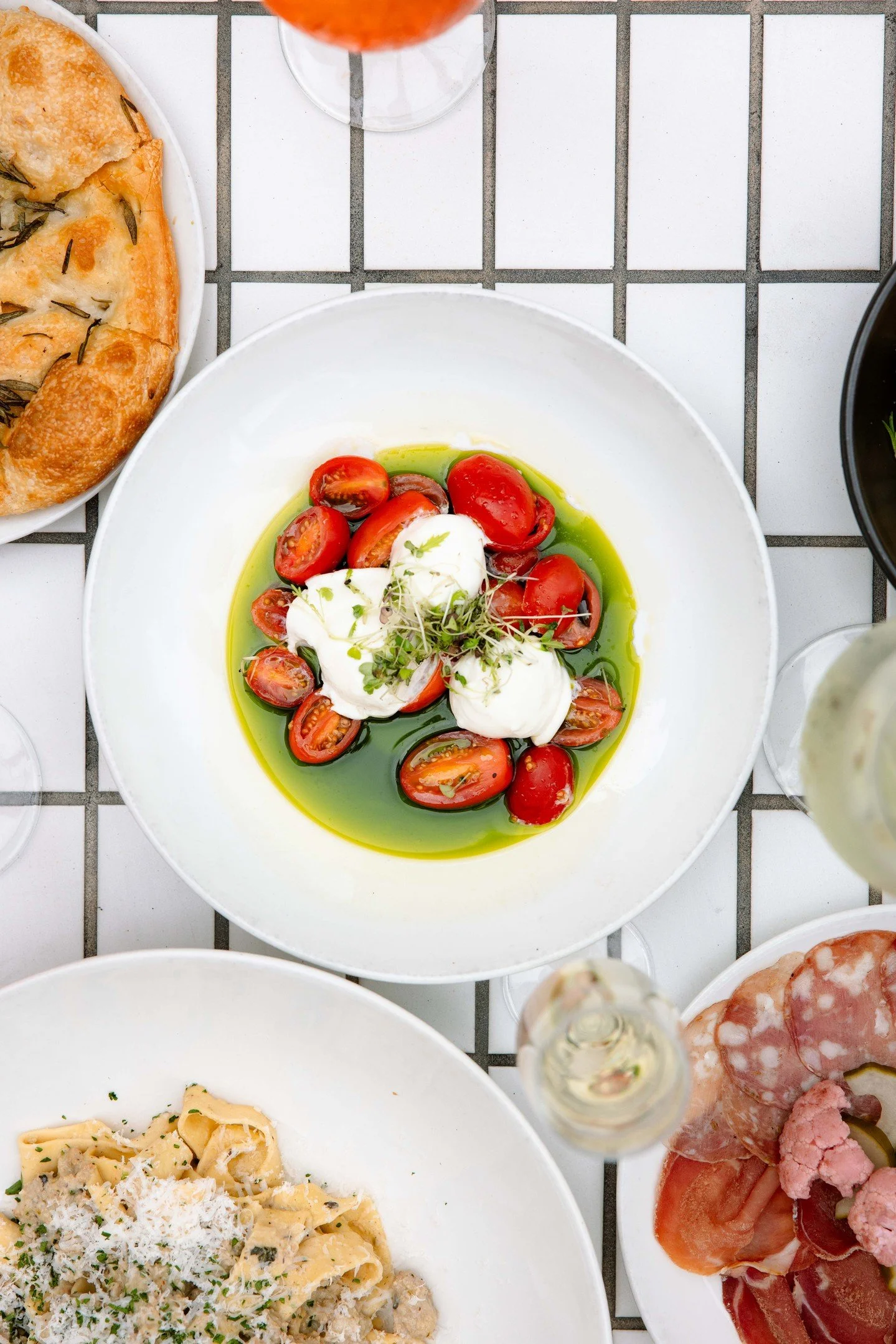 Caprese di Bufala with fresh mozzarella, tomatoes and basil. Fresh, vibrant and full of flavour.