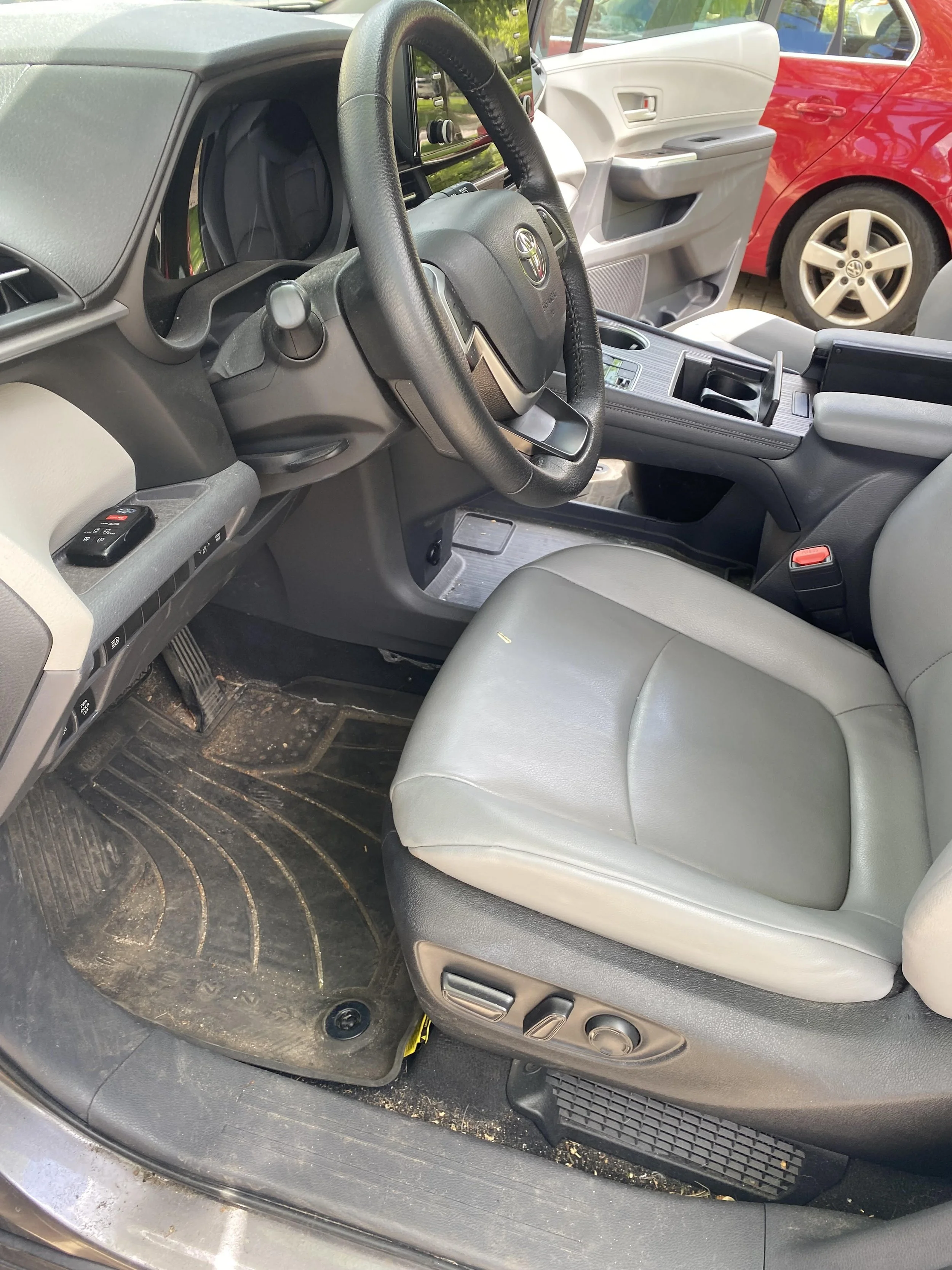 Car interior with leather seats and steering wheel