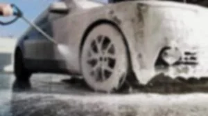 Car being washed with soap and water
