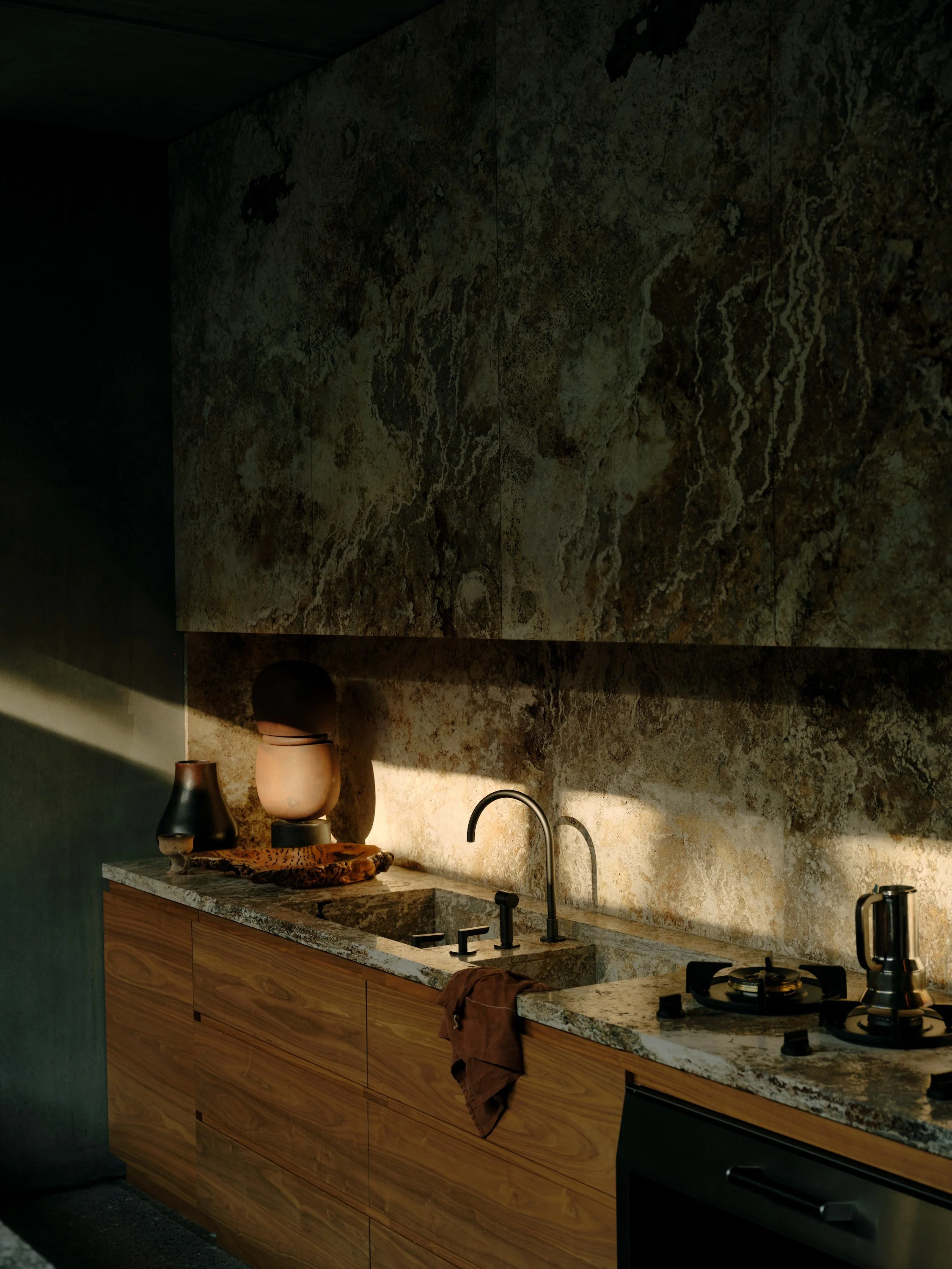 Subtle, modern kitchen with Walnut cabinetry, Travertine benchtop and splashback. A nod to the warm earthy tones and textures.
