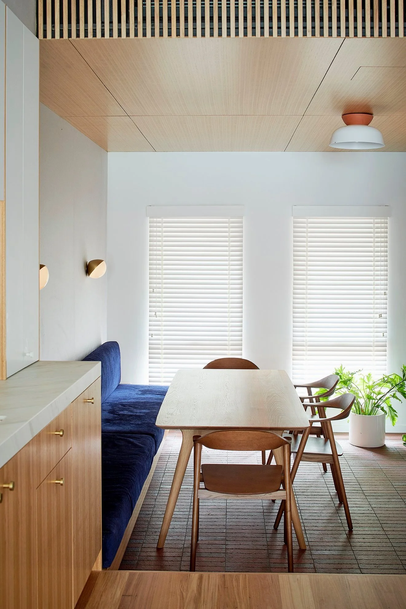 Clean and modern dining. Warm Ash timber cabinetry complimented with matching ceiling linings.