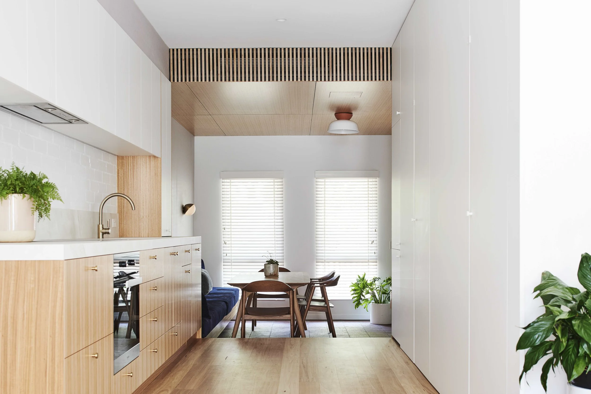 Hiding all those unsightly necessities in plain sight. Ducted climate control clad in Ash lining transitioning into the living area.