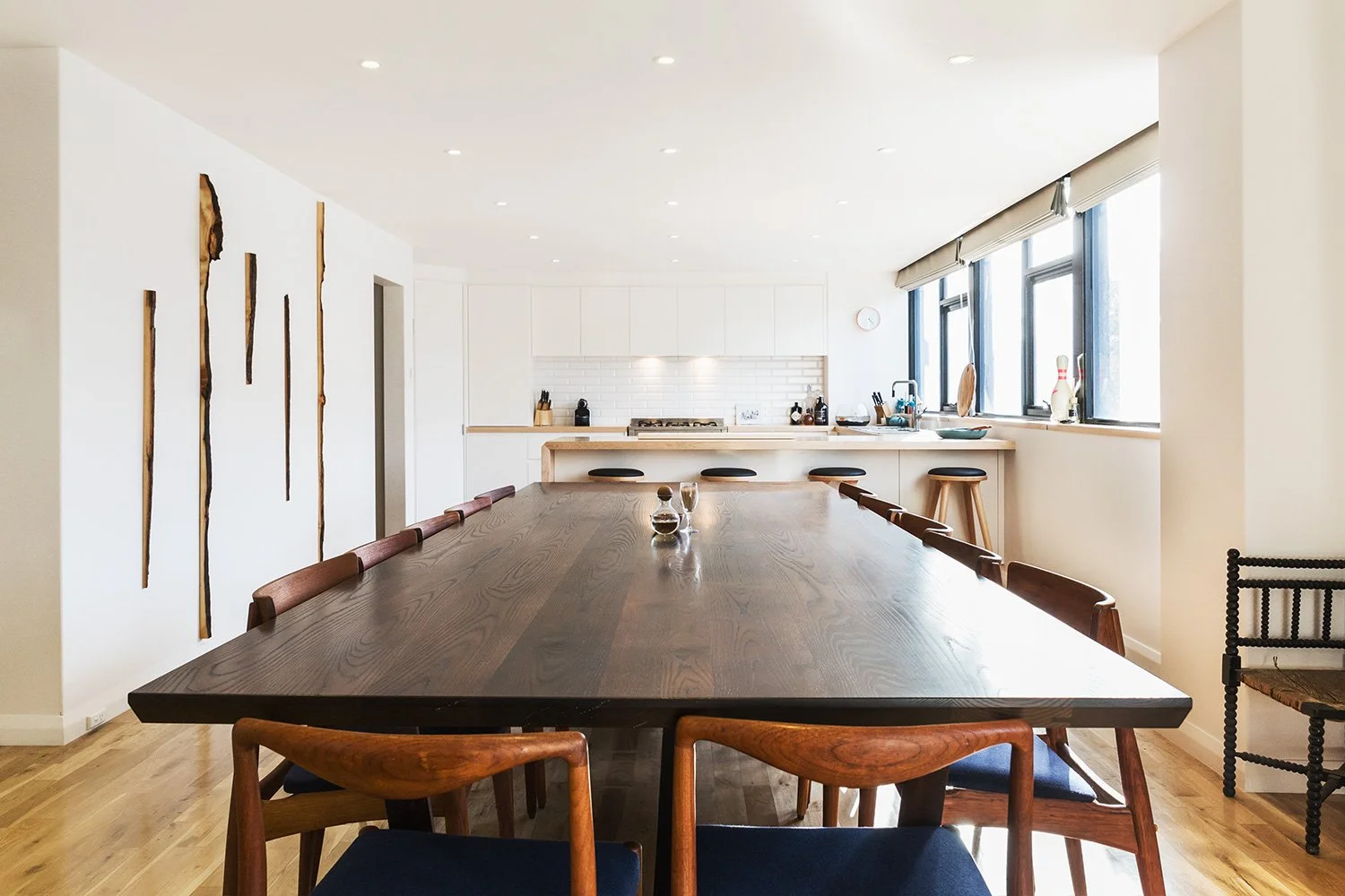 Custom 10-seater Cambia Ash dining table. Craned through the window into this 2nd floor apartment.