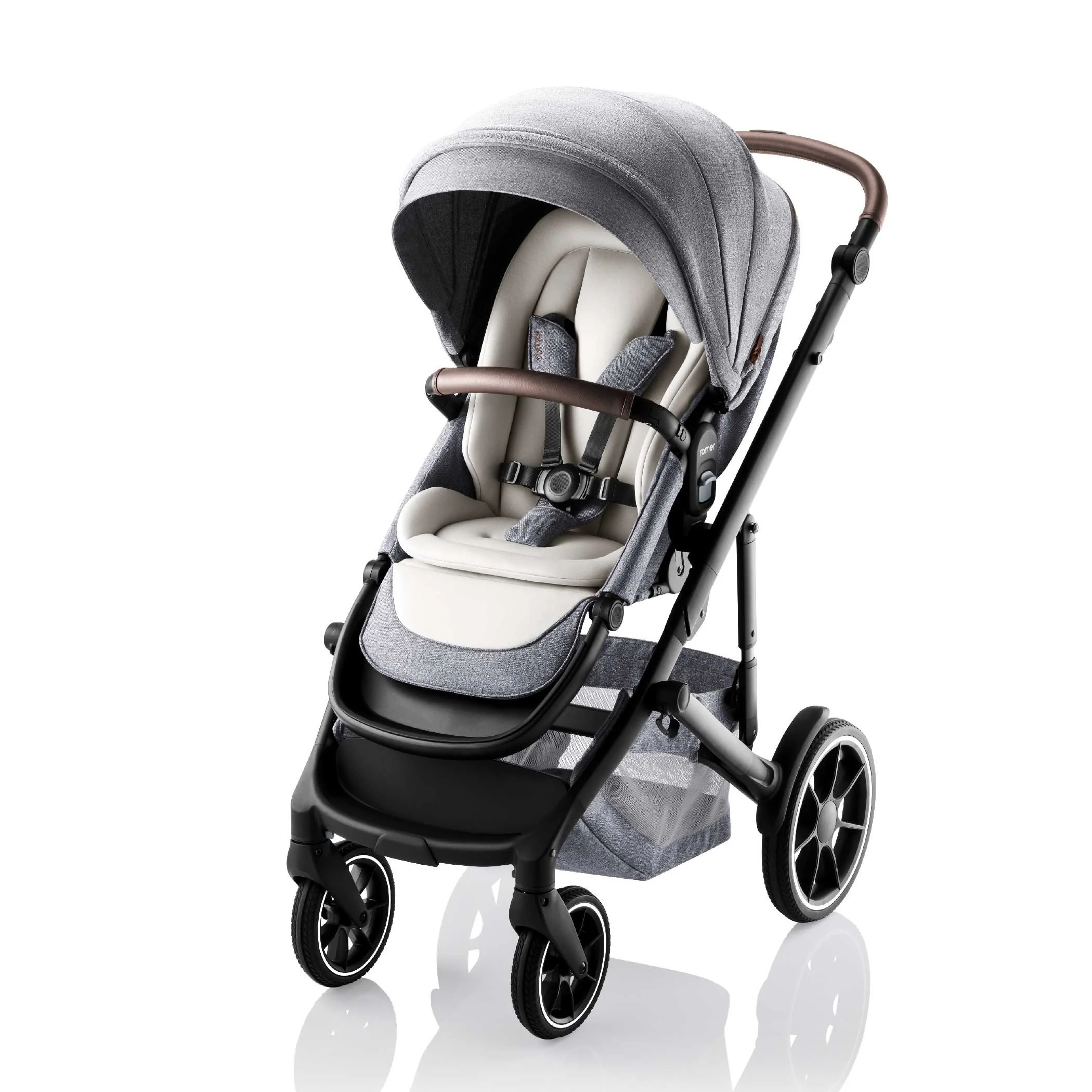 Grey and white baby stroller with leather on the handlebar and bumper bar.