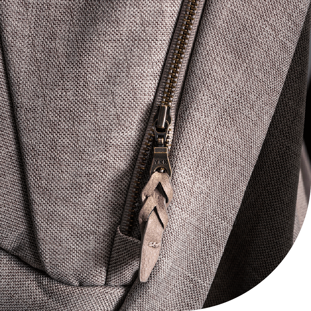 leather accented zipper pull