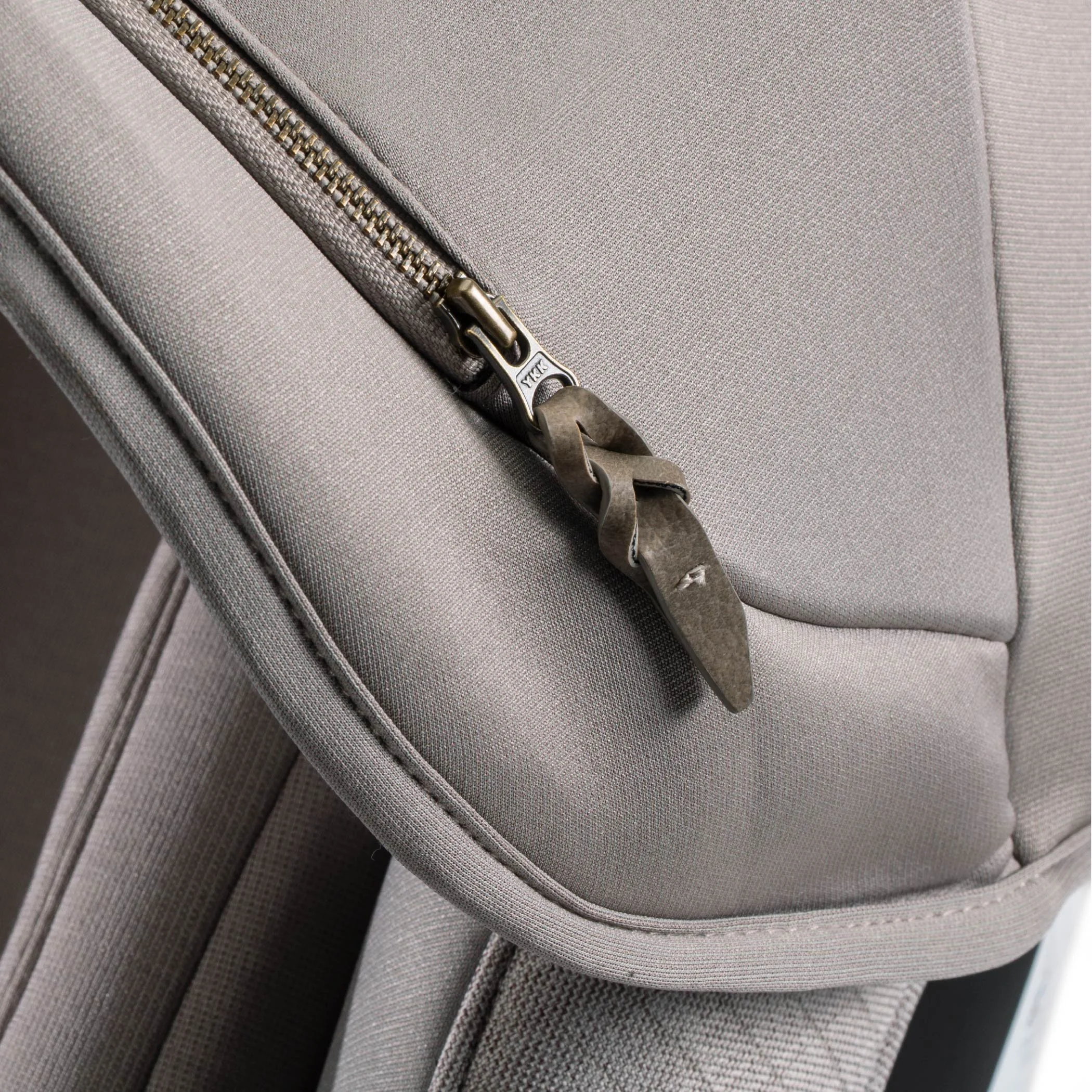 Leather accented zipper pull on canopy