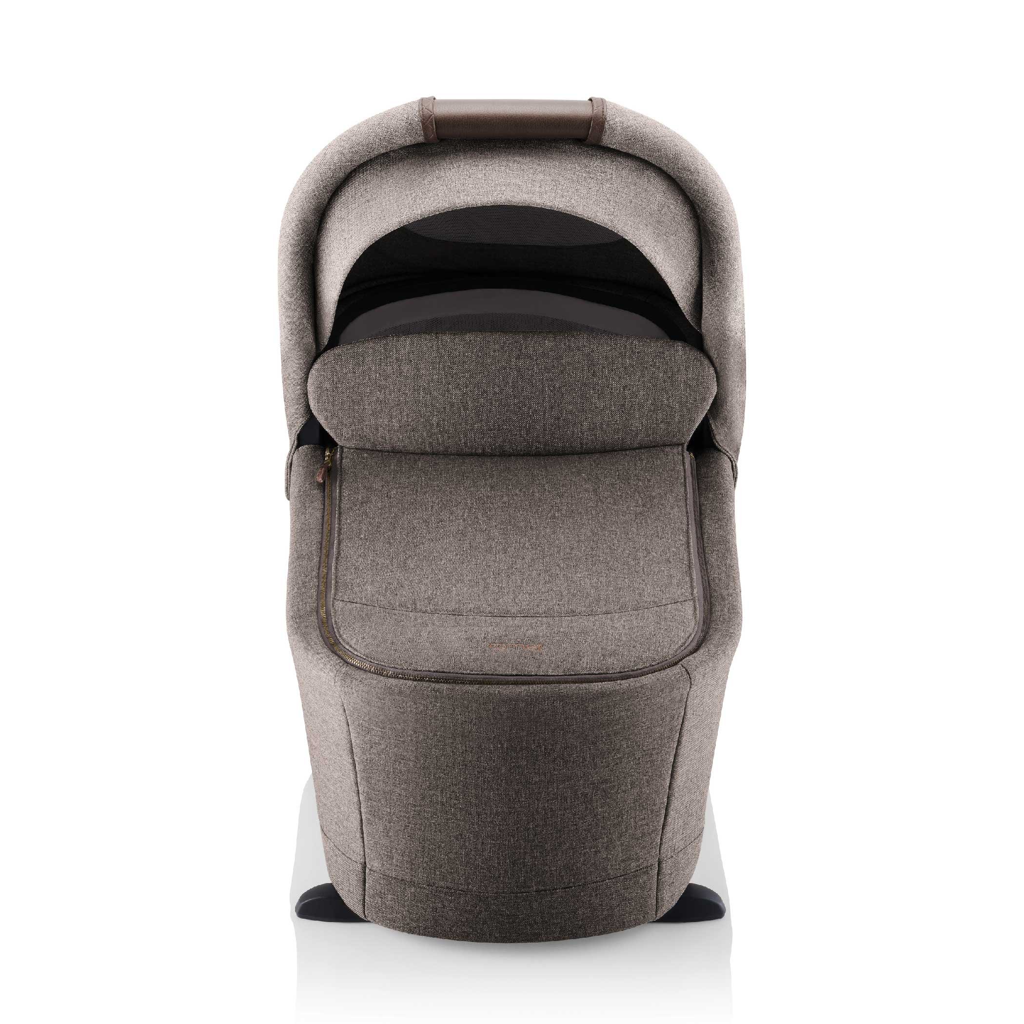 A brown baby bassinet.
