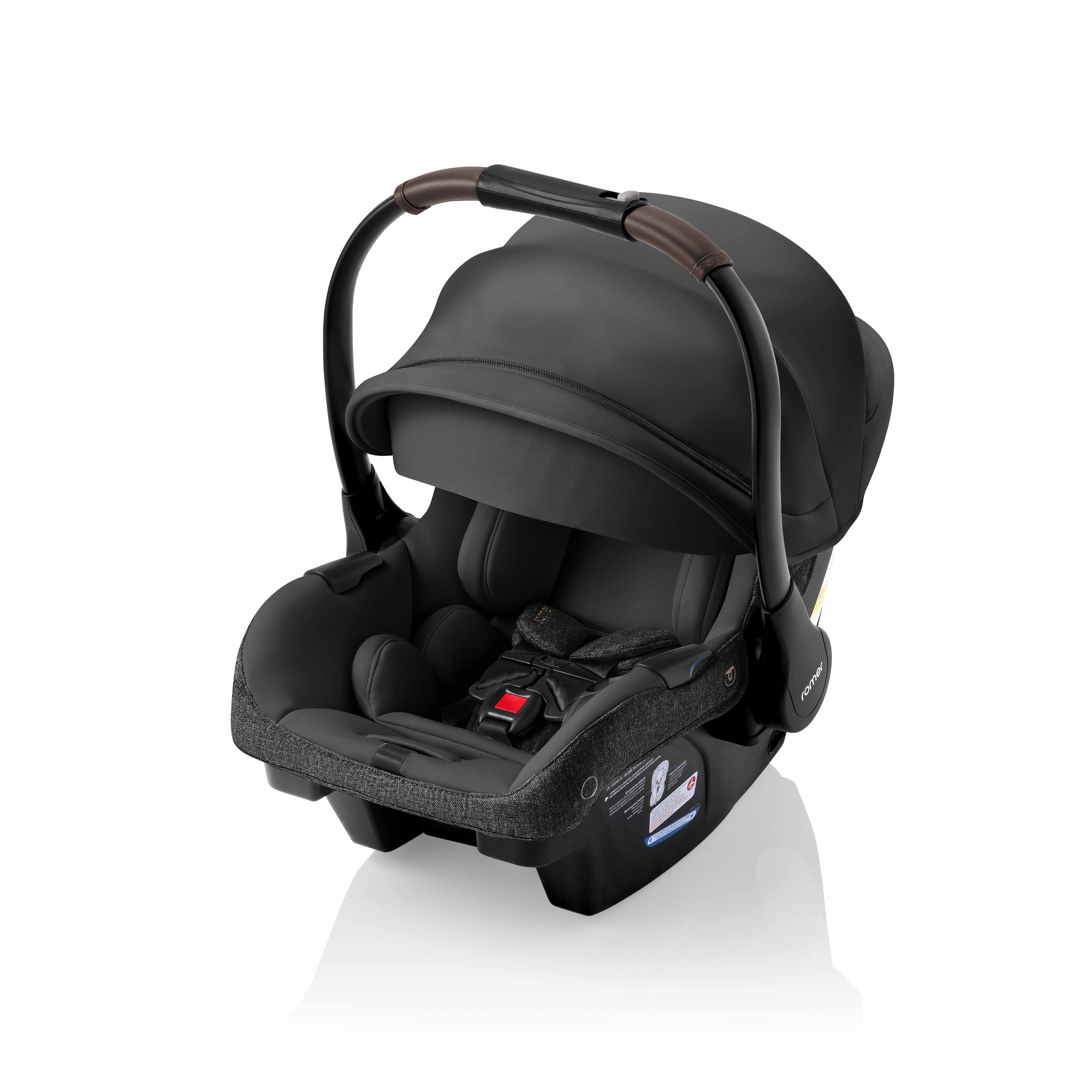 A black infant car seat with a canopy and carry handle.