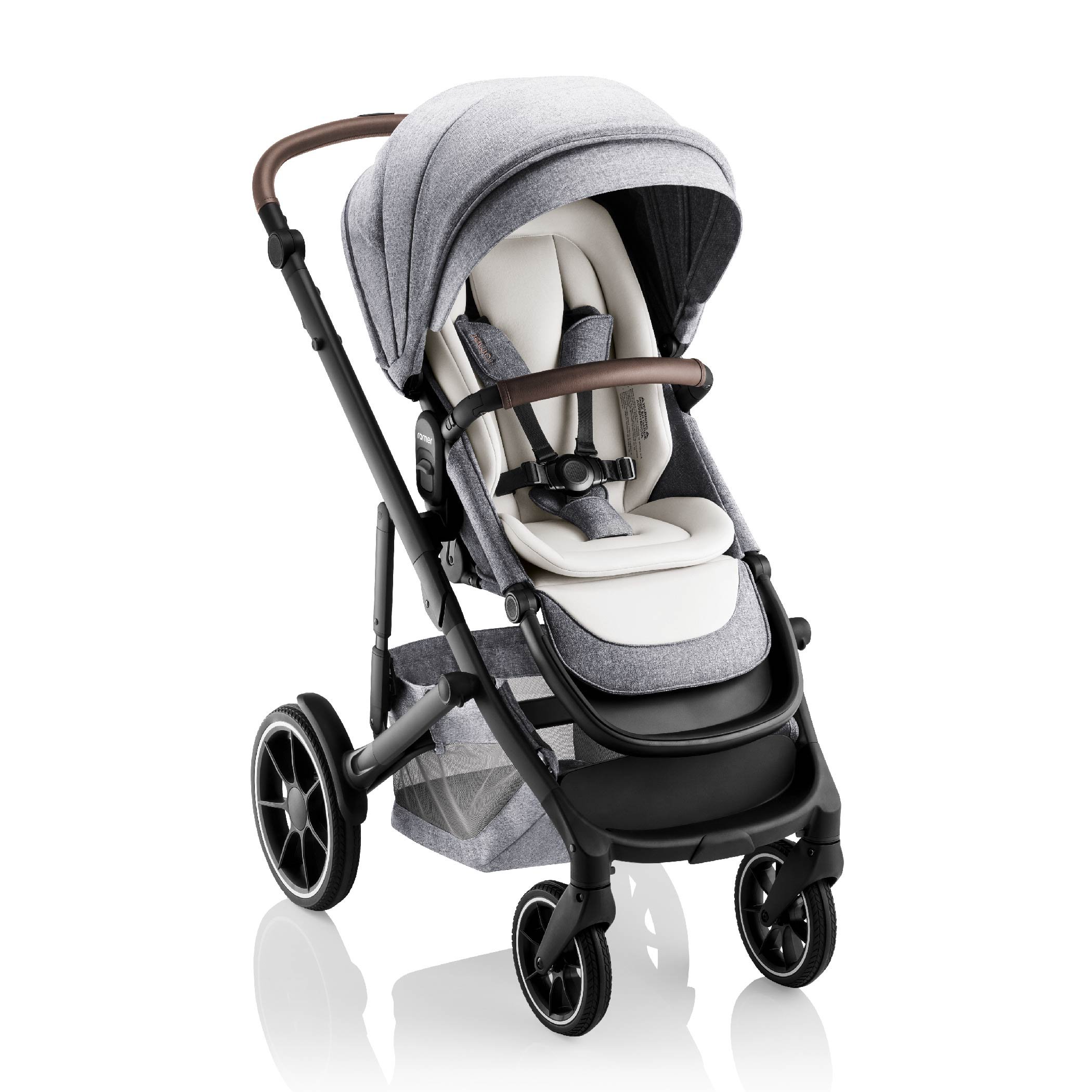 Grey and white baby stroller with leather on the handlebar and bumper bar.