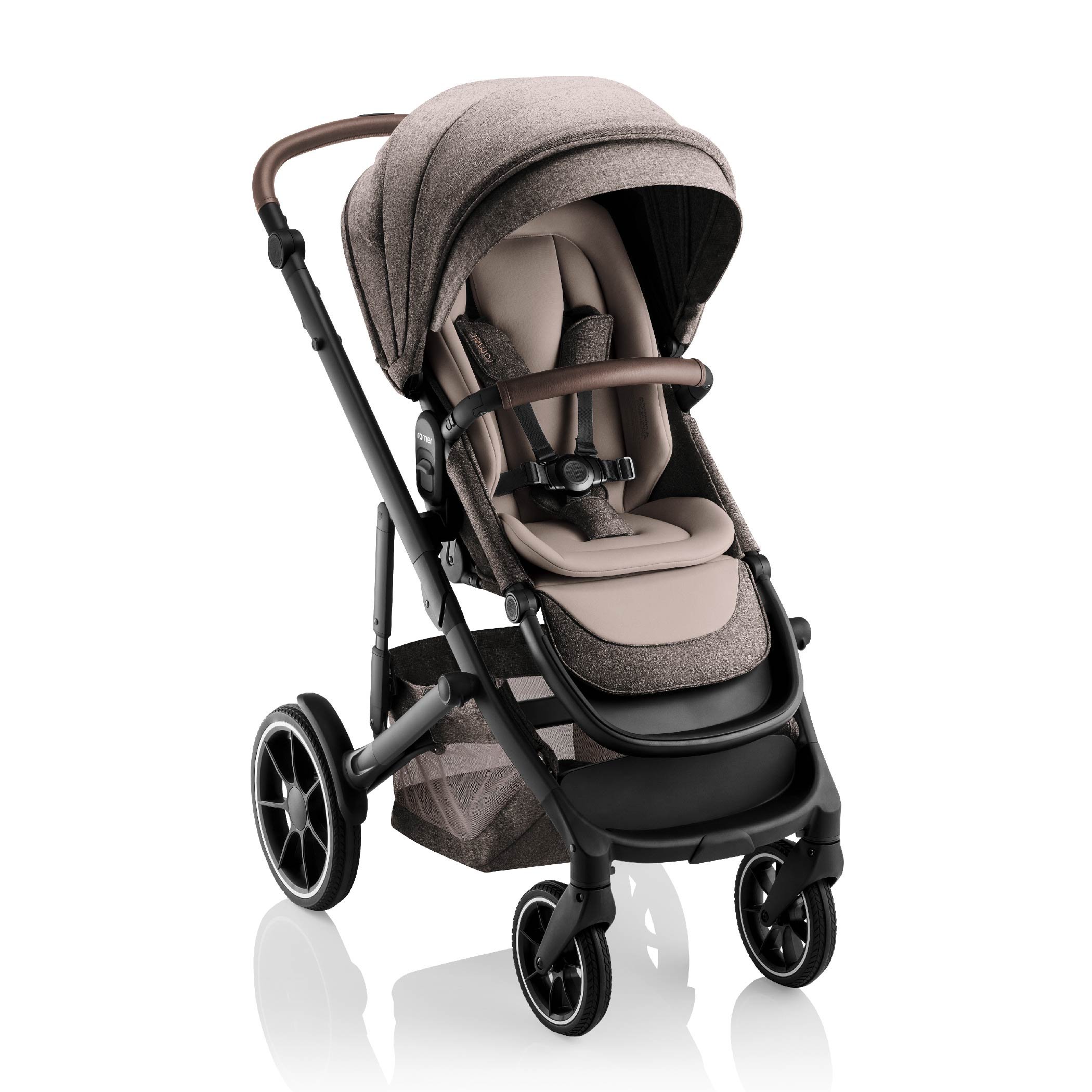 Brown and tan baby stroller with leather on the bumper bar.