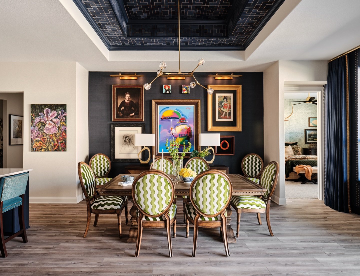 A dining room should feel like an experience.

In this Bandanna project, we layered collected artwork, patterned dining chairs, and a dramatic backdrop to create a space that feels both welcoming and memorable.

One of my favorite ways to bring perso