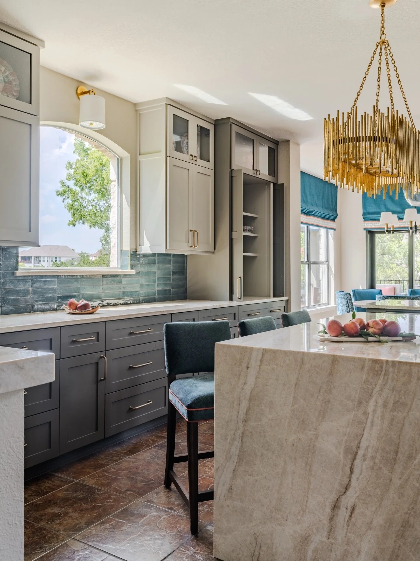 This Shug Cove kitchen was designed to feel layered, tailored, and beautifully connected to the surrounding spaces. The layout was reconfigured for better flow, replacing a curved peninsula and corner sink with a more functional arrangement. We reloc
