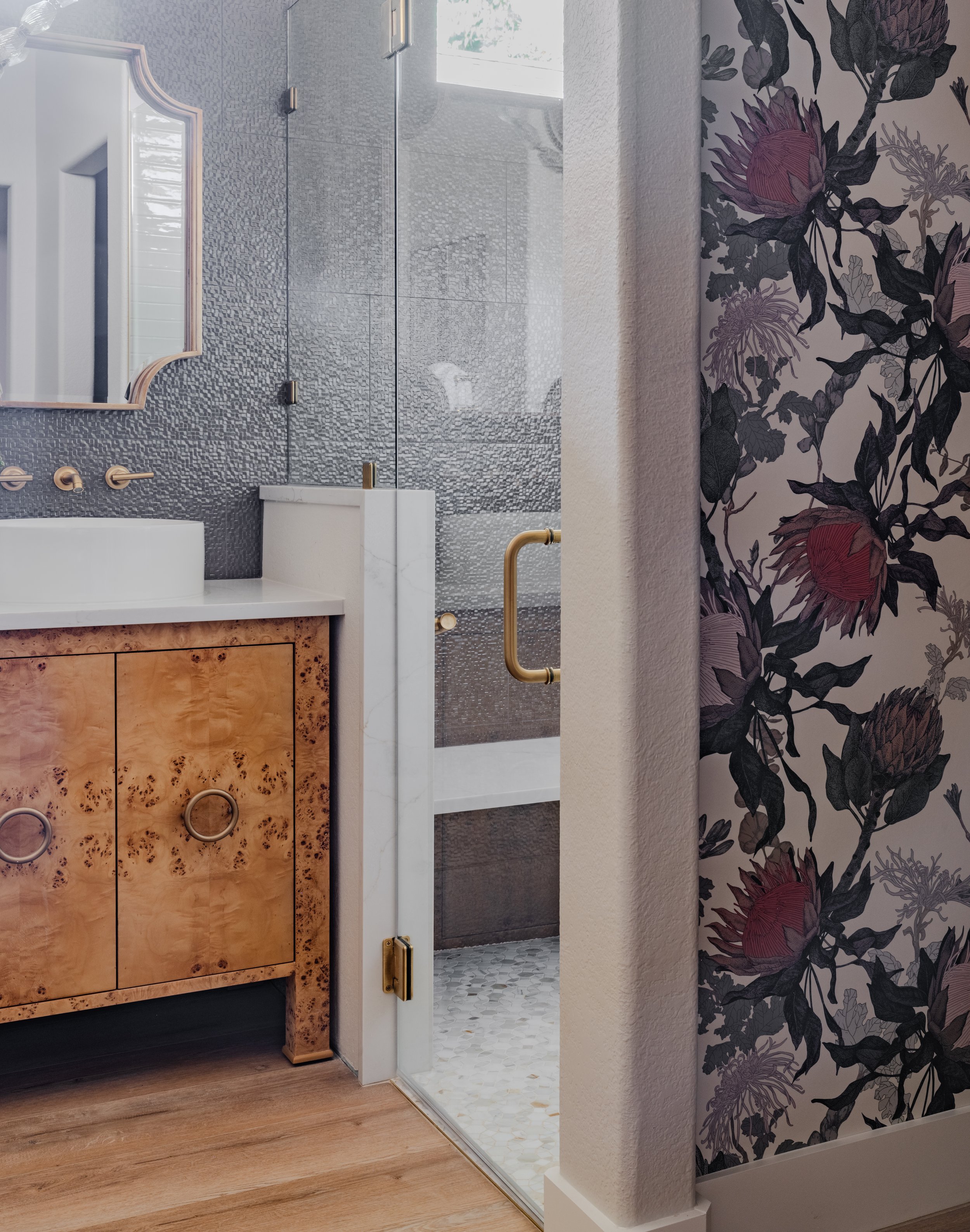 Curbless shower renovation with marble mosaic flooring and dimensional tile.