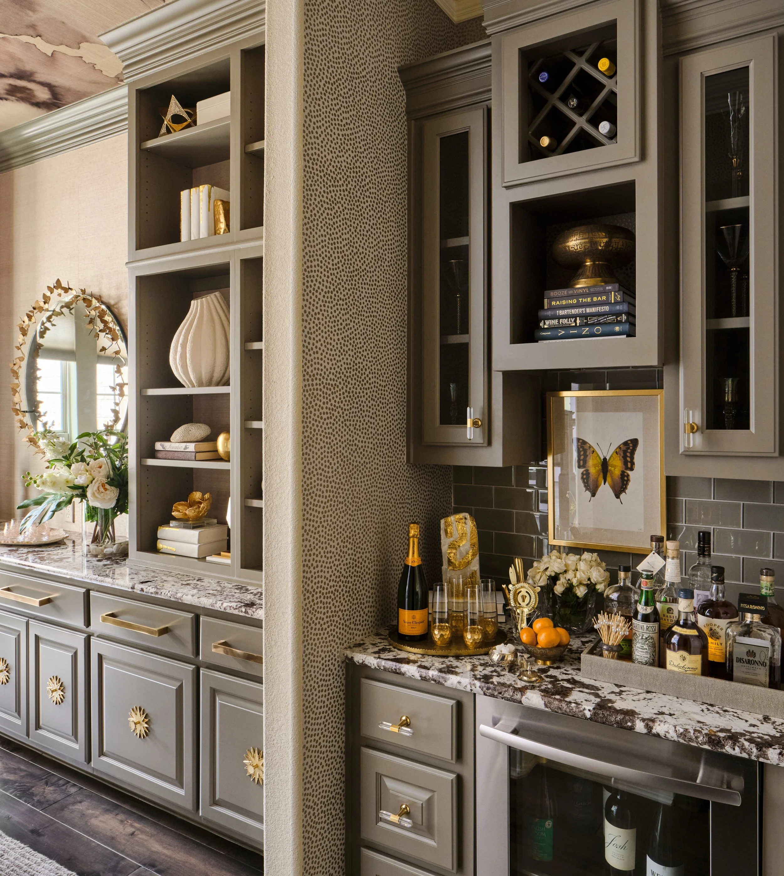 The transition between the dining room and wine bar was designed to feel seamless and intentional. Custom cabinetry and cohesive material selections create visual continuity, allowing the spaces to work beautifully together while enhancing both enter