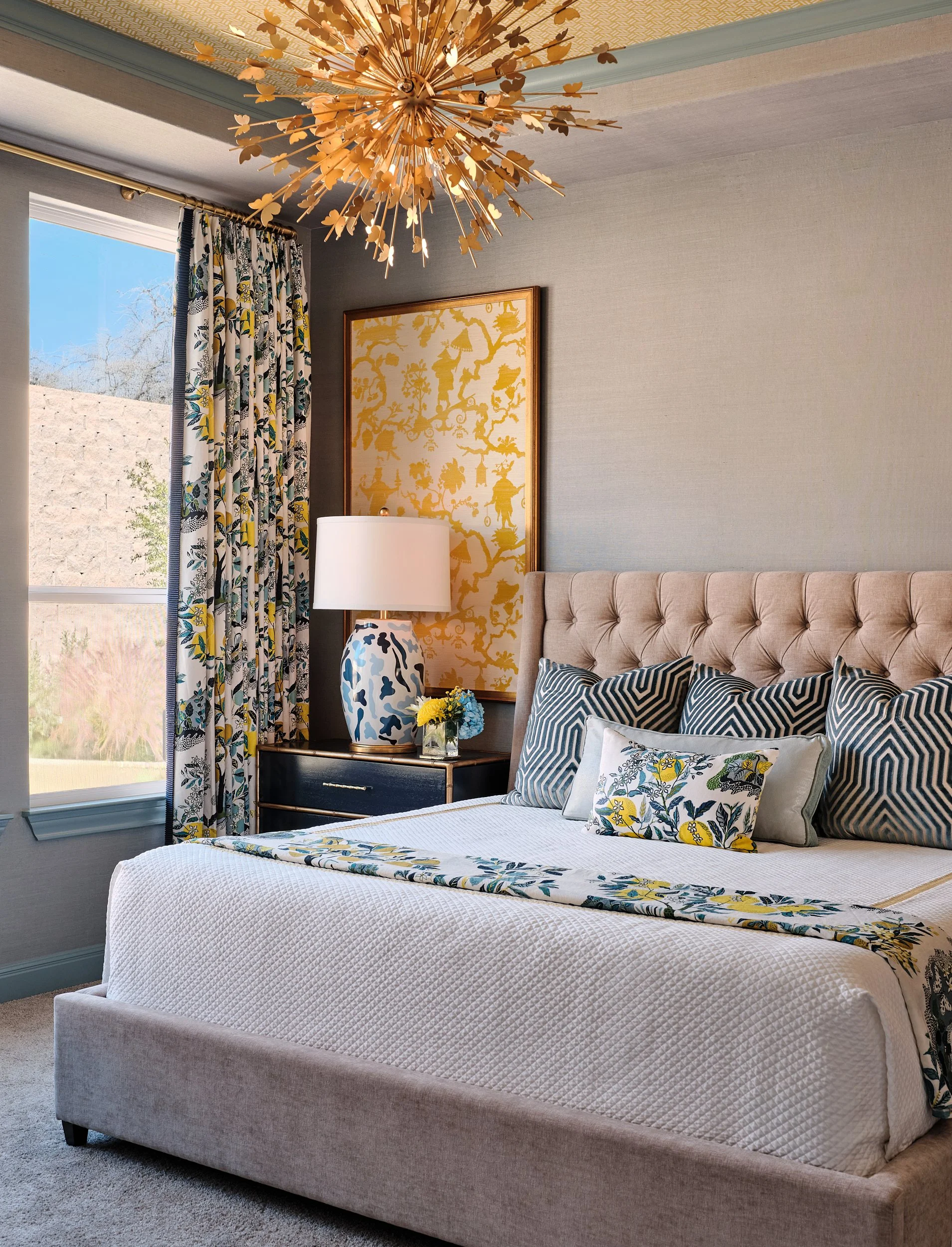Primary bedroom designed by Cyndi Hopkins Design for the Bandana Lane project in Georgetown, Texas. A Miles Redd Tumbling Block wallpaper applied to the ceiling creates a dramatic architectural moment, while the walls are wrapped in a shimmering Schu