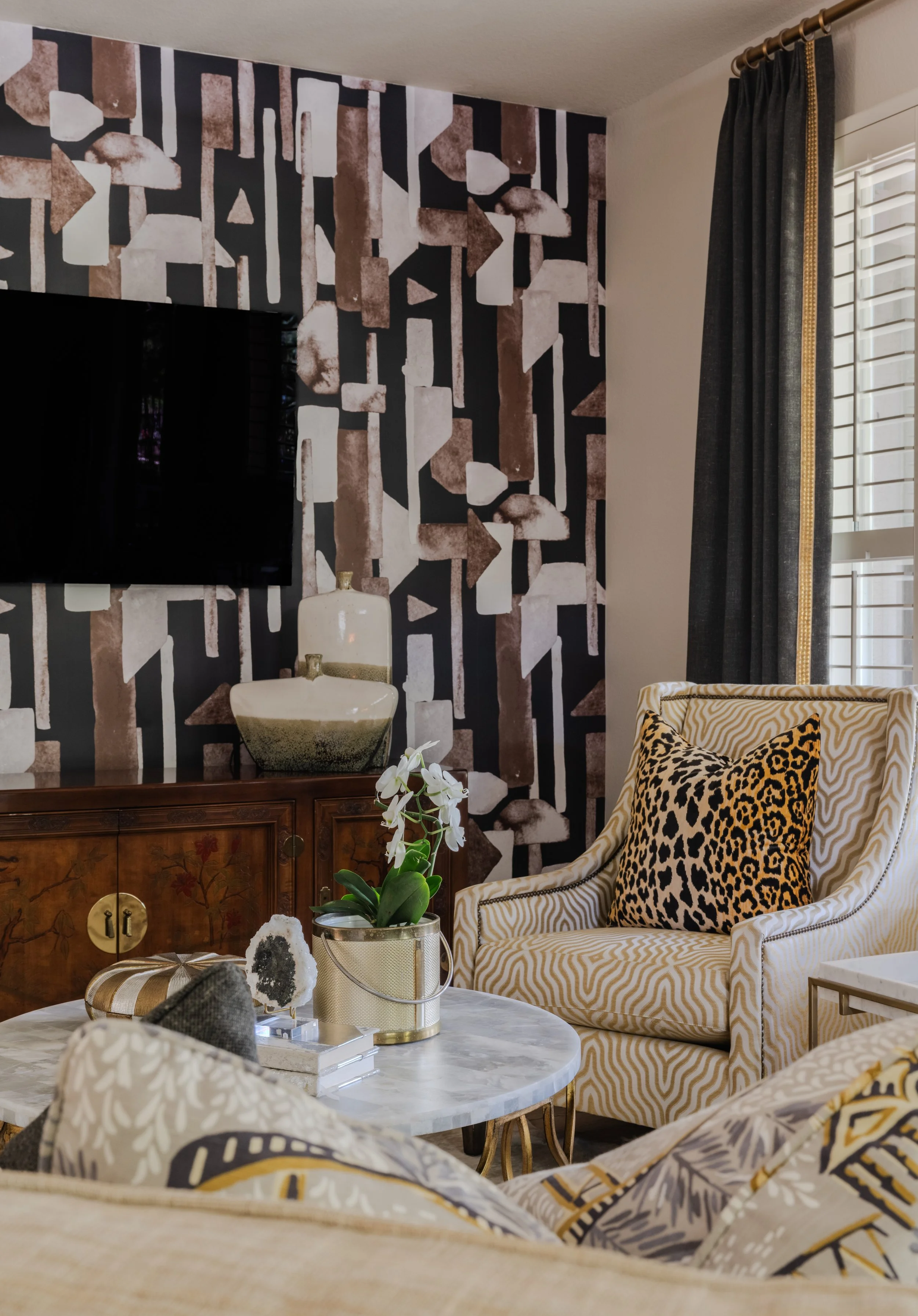 Wallcovering and styled vignette in Sun City Georgetown Texas home designed by Cyndi Hopkins Design.