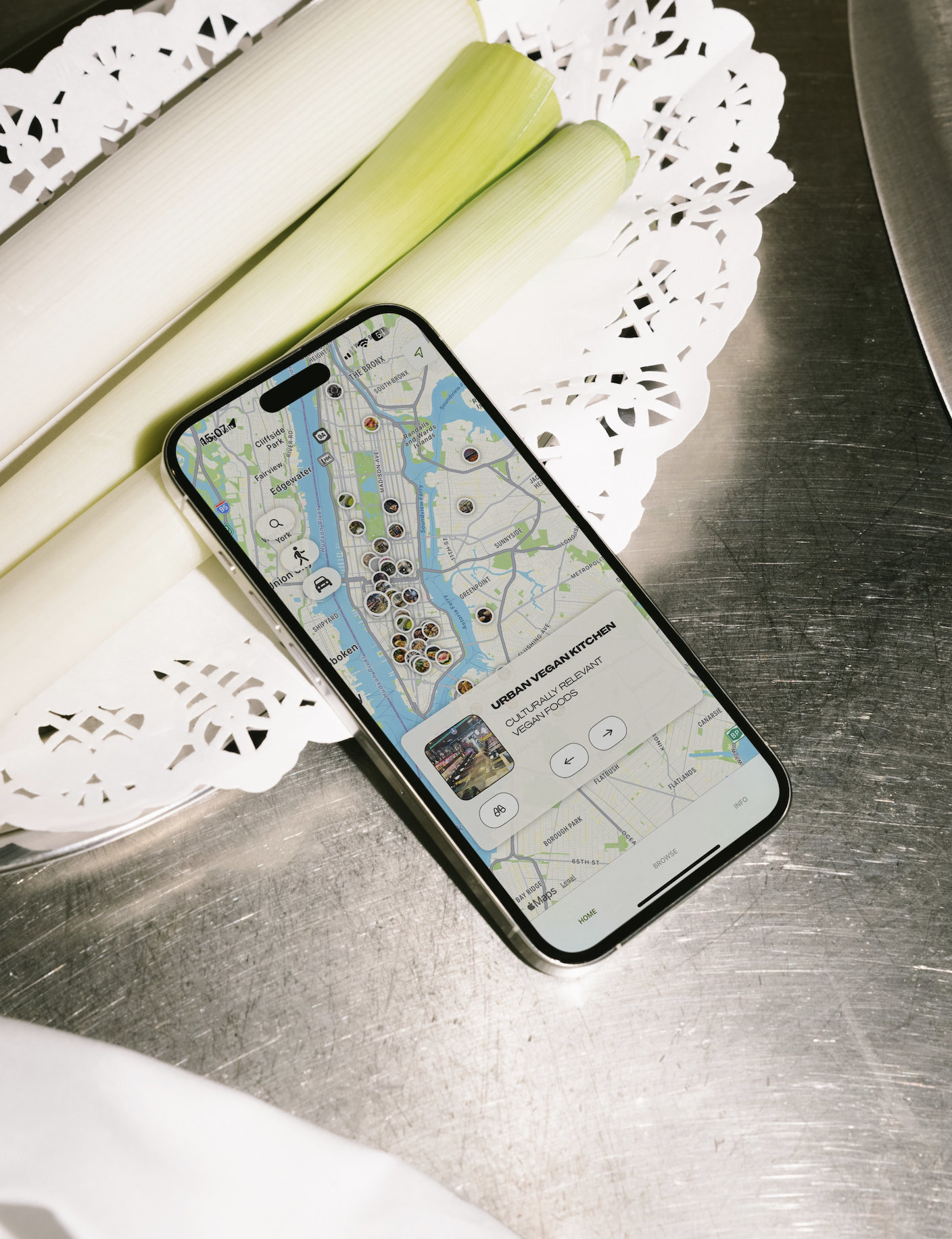 iPhone on kitchen table, displaying a screen from the Lost & Vegan App
