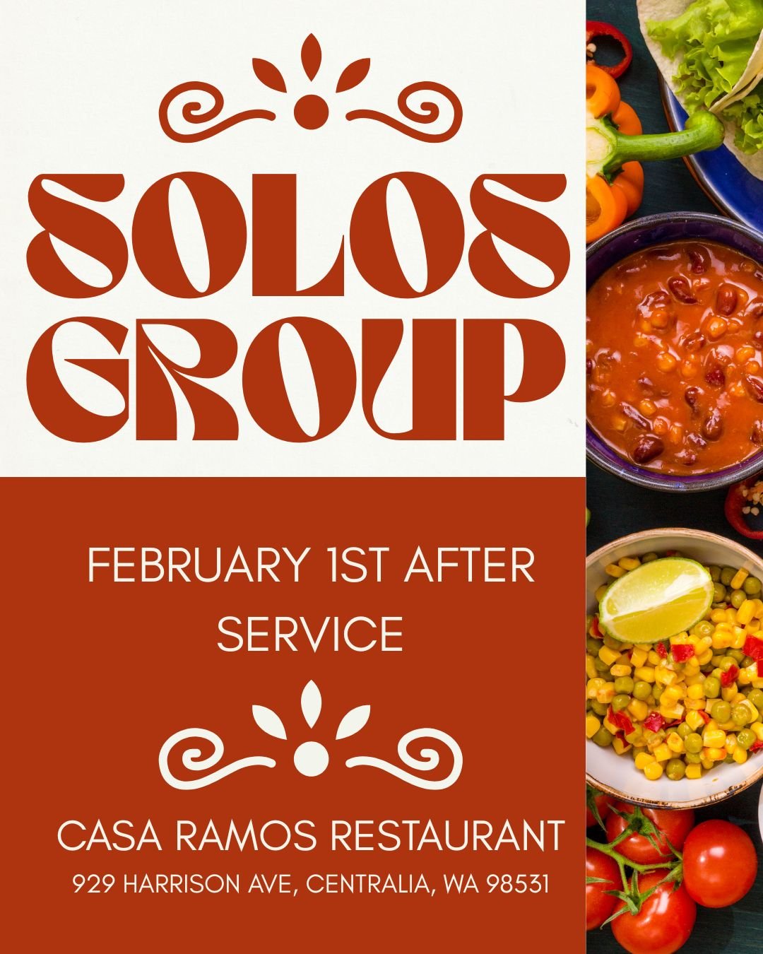 A group of people sharing a meal with plates of salad, rice, and a bowl of soup on a wooden table.