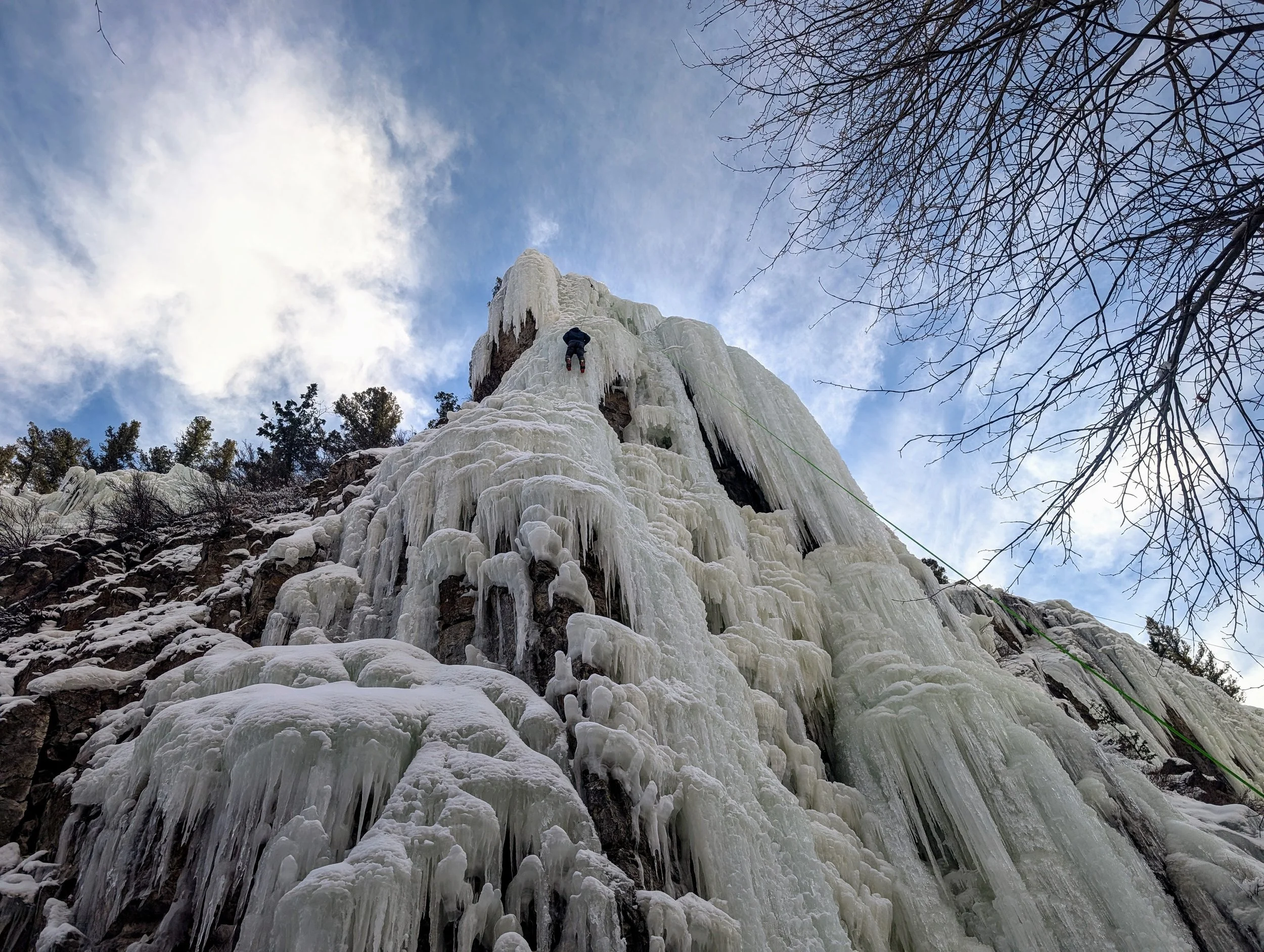 Ice climber climbing ice in the Lake City Ice Park