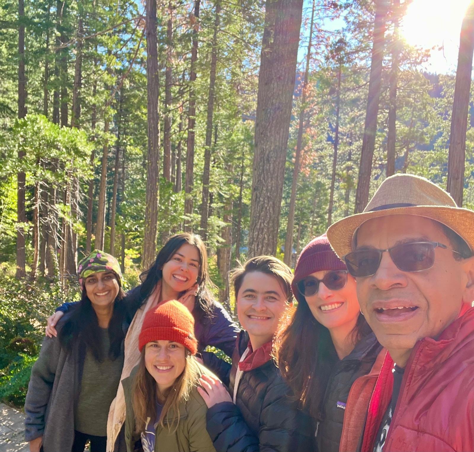 smiling group of eco-chaplains in the woods