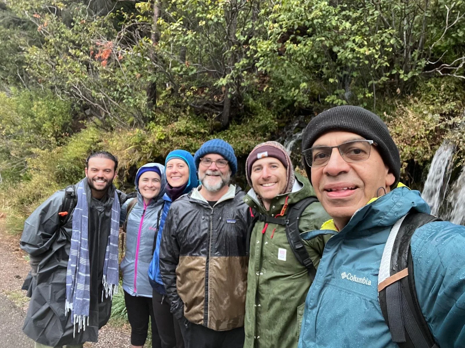 smiling group of eco-chaplains in the woods