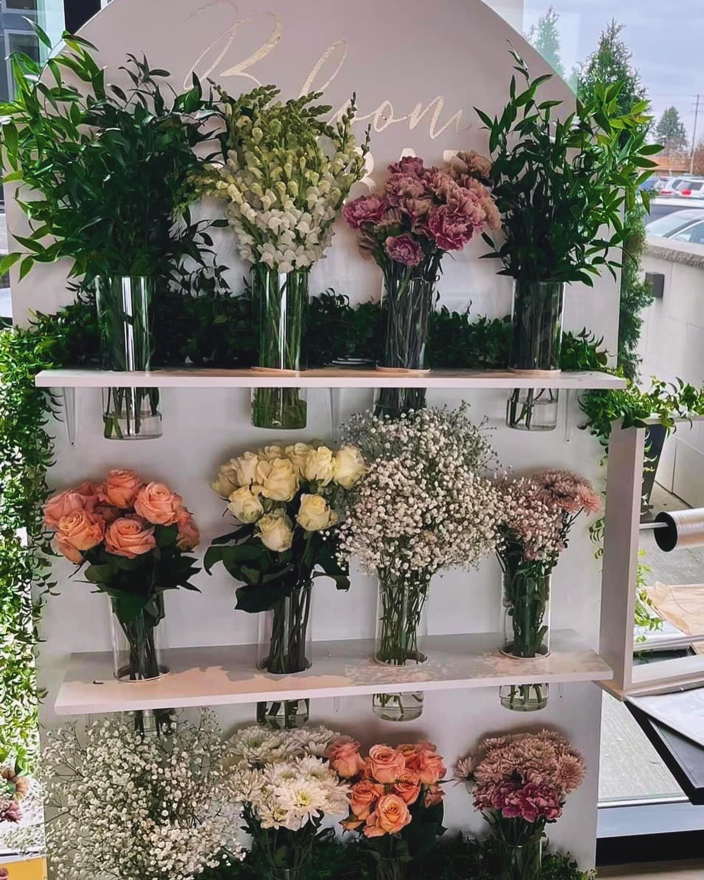 Transform your event with our Bloom Bar stations! 🌸✨ We offer TWO fabulous Bloom Bar stations to elevate your event! ✨ 

🌷 Our large Bloom Bar, complete with vases, ribbon, and a flower bar, is available for $150. 

🌻 For a more budget-friendly op