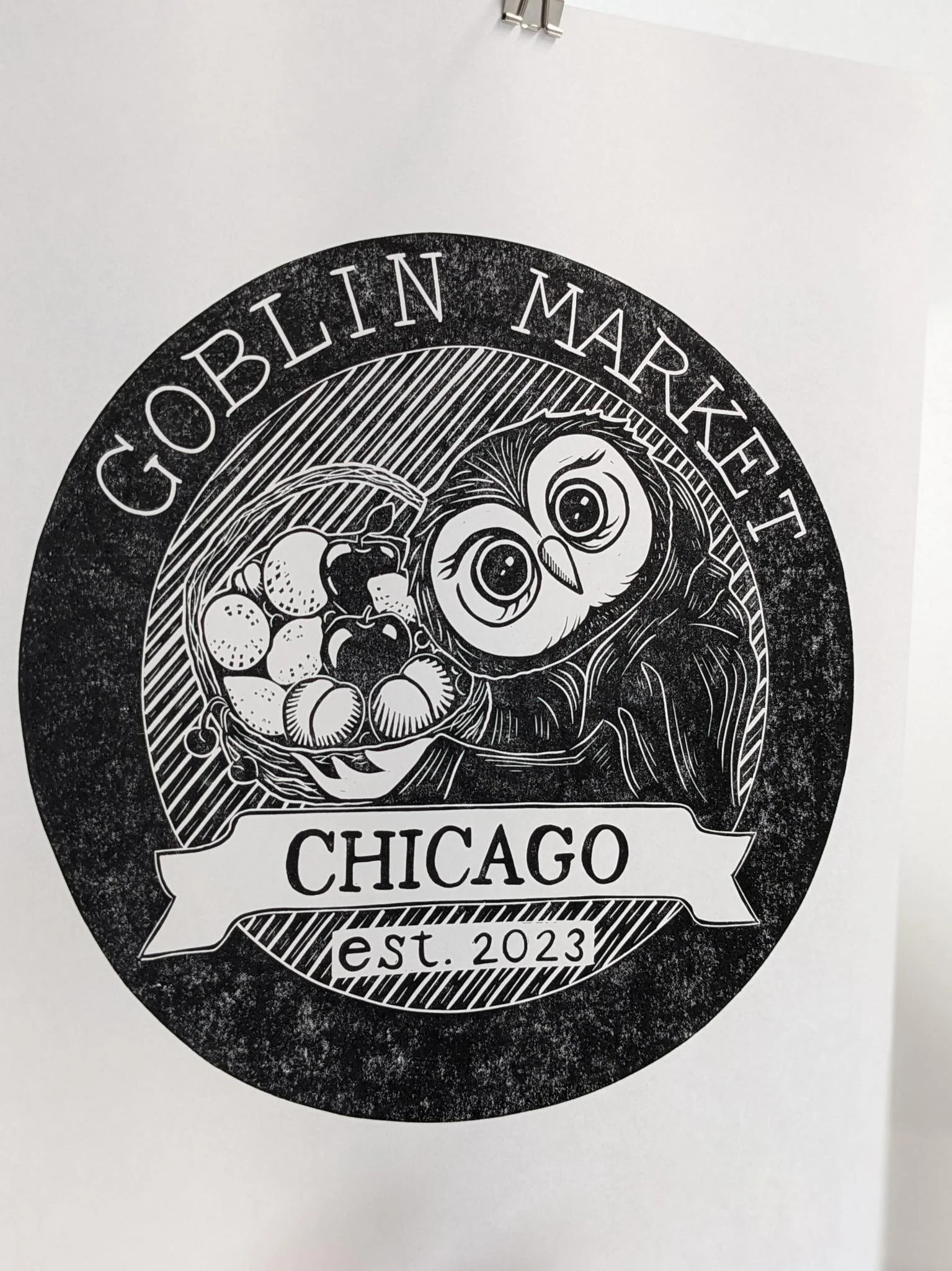 Design for GOBLIN MARKET CHICAGO, established in 2023, featuring a cartoon goblin holding a basket of assorted vegetables and fruit.