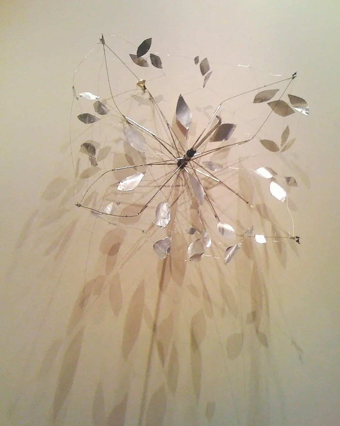 “Shelter/After” - created for The Cradle Project made from found trash on greenbelt (Umbrella parts and beer cans)